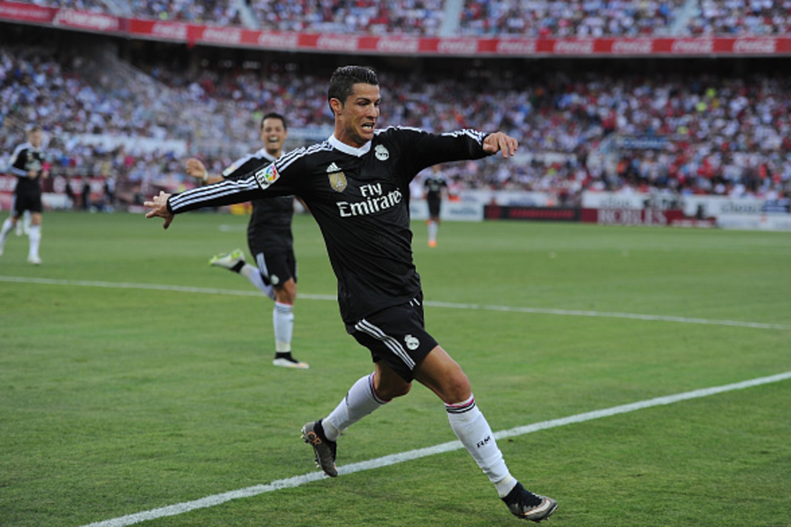 SEVILLE, SPAIN - MAY 02:  Cristiano Ronaldo of Real Madrid celebrates after scoring his team's 2nd goal during the La Liga match between Sevilla FC and Real Madrid CF at Estadio Ramon Sanchez Pizjuan on May 2, 2015 in Seville, Spain.  (Photo by Denis Doyl