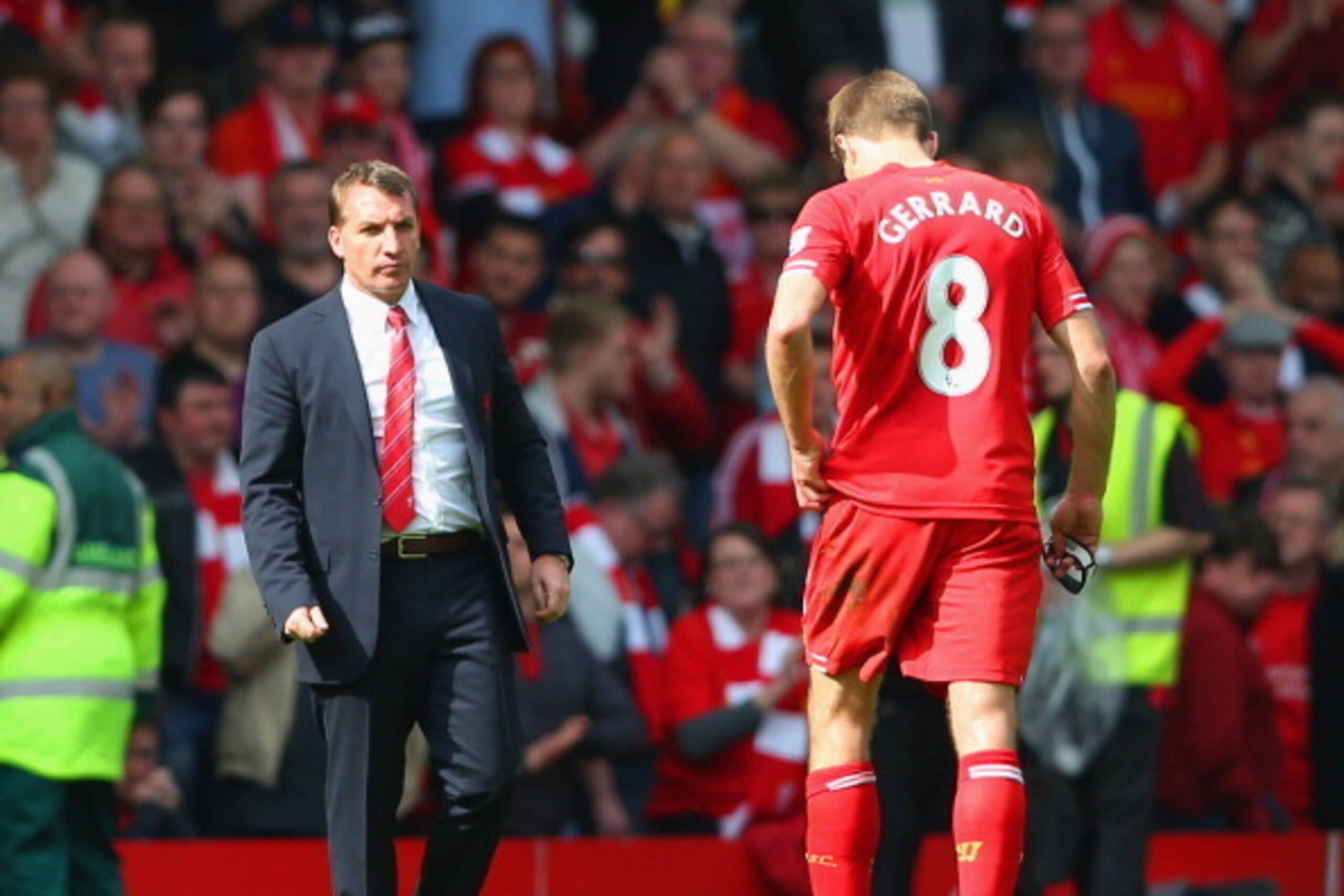 LIVERPOOL, ENGLAND - APRIL 27:  Manager Brendan Rodgers of Liverpool looks to a dejected Steven Gerrard of Liverpool at the end of the match during the Barclays Premier League match between Liverpool and Chelsea at Anfield on April 27, 2014 in Liverpool, 