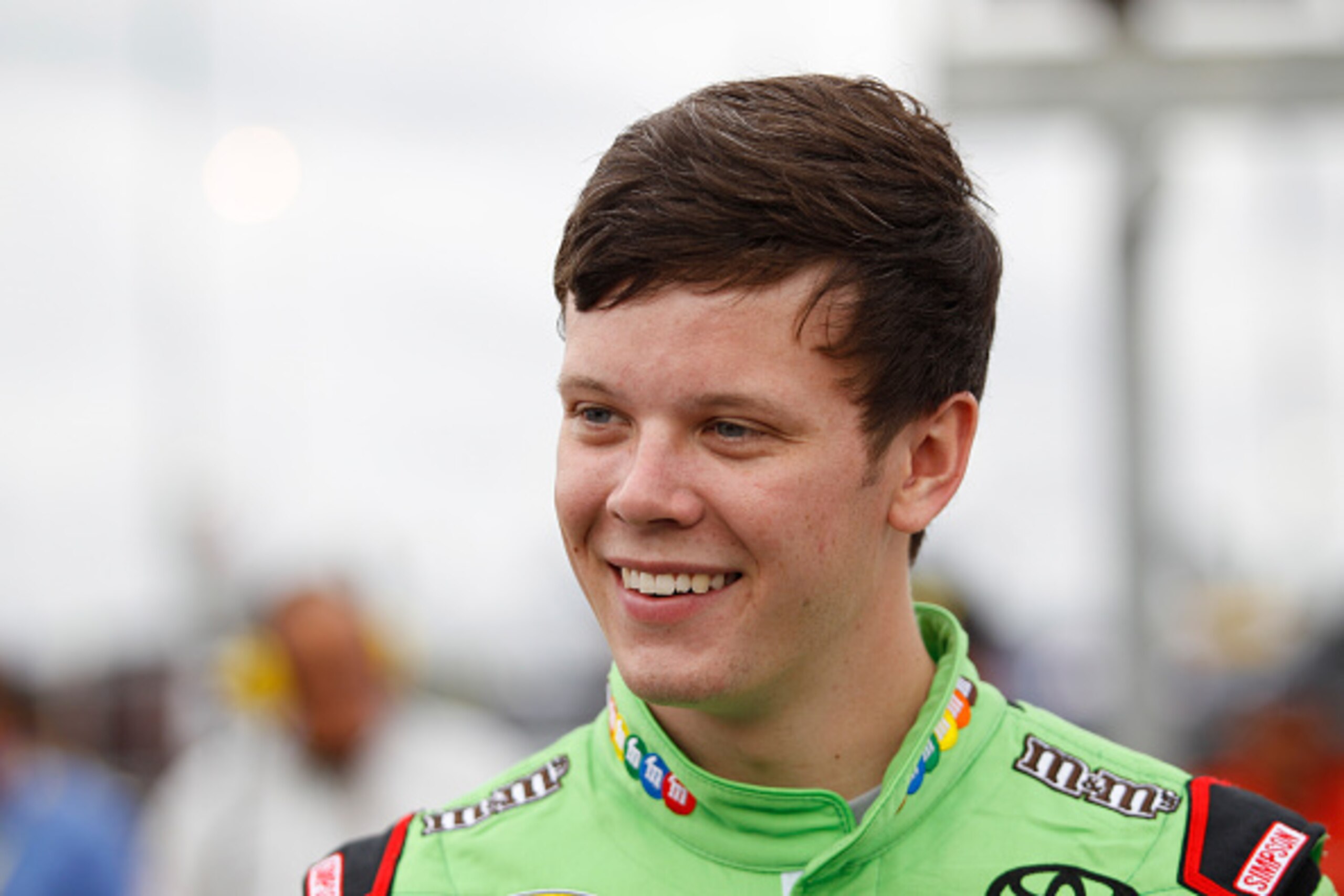 KANSAS CITY, KS - MAY 09:  Erik Jones, driver of the #18 M&M's Red Nose Day Toyota, stands on pit road before the start of the NASCAR Sprint Cup Series SpongeBob SquarePants 400 at Kansas Speedway on May 9, 2015 in Kansas City, Kansas.  (Photo by Kena Kru