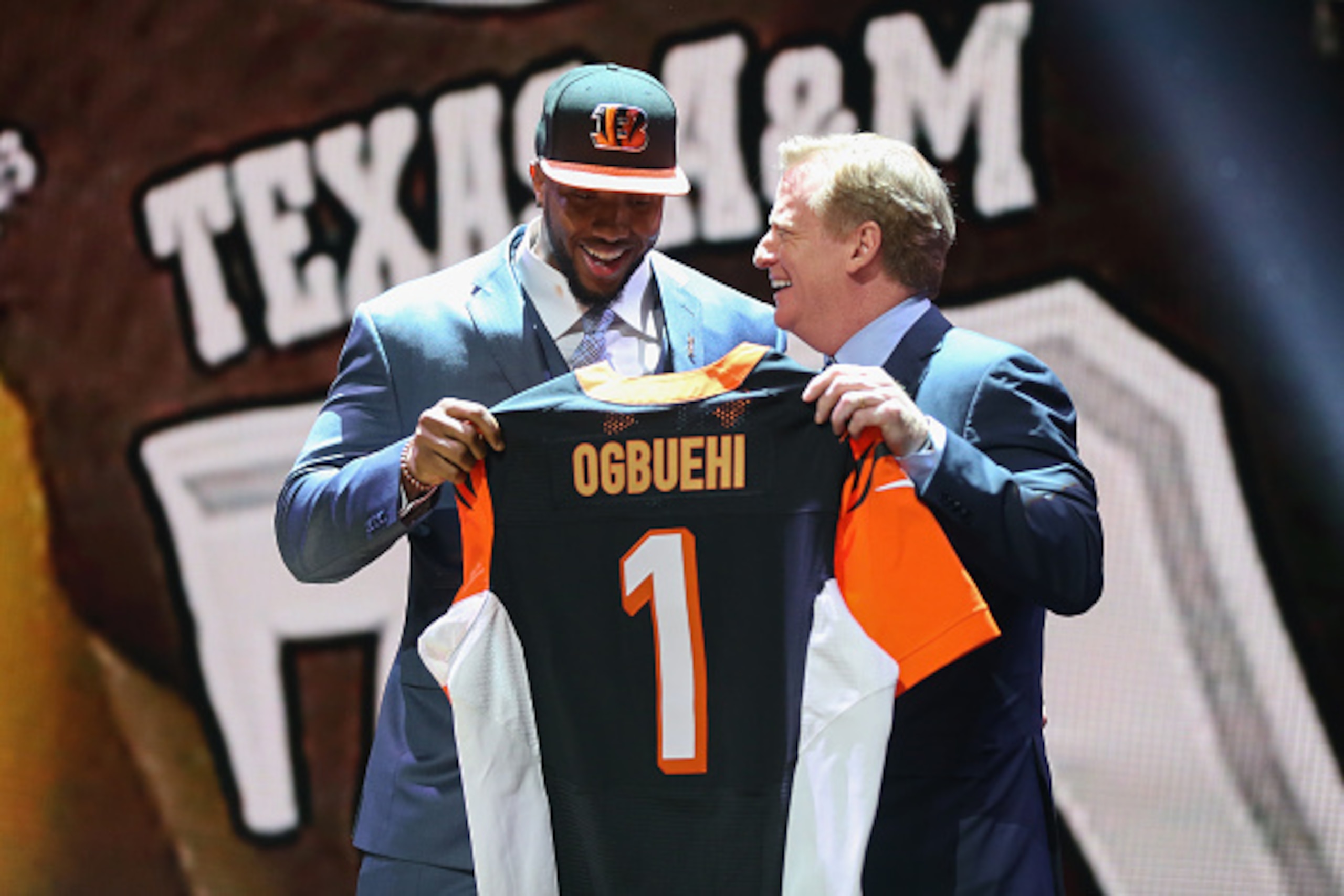 CHICAGO, IL - APRIL 30:  Cedric Ogbuehi of the Texas A&M Aggies holds up a jersey with NFL Commissioner Roger Goodell after being picked #21 overall by the Cincinnati Bengals during the first round of the 2015 NFL Draft at the Auditorium Theatre of Roosev