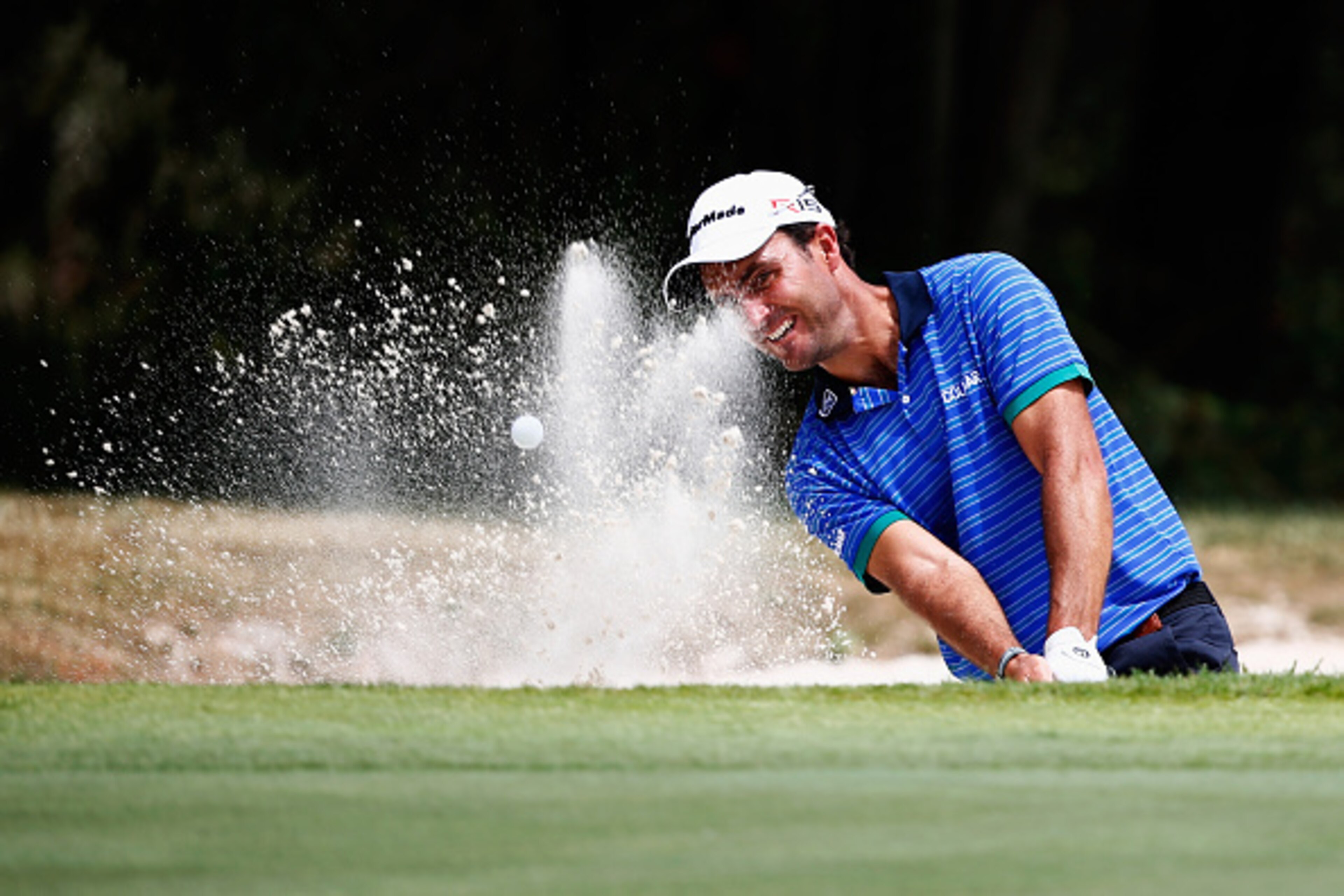 BARCELONA, SPAIN - MAY 14:  Edoardo Molinari of Italy hits his 3rd shot on the 9th hole out of the bunker during Day 1 of the Open de Espana held at Real Club de Golf el Prat on May 14, 2015 in Barcelona, Spain.  (Photo by Dean Mouhtaropoulos/Getty Images