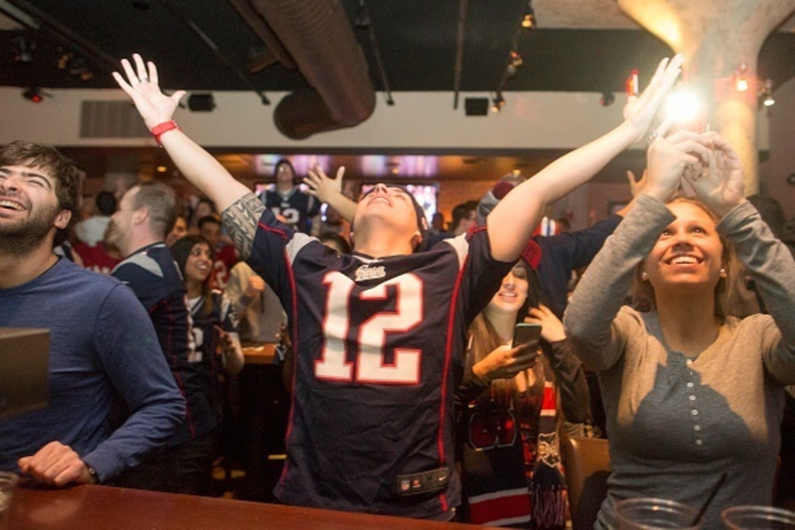 OSTON, MA - FEBRUARY 1: New England Patriots fans cheer after the Patriots defeated the Seattle Seahawks in Super Bowl XLIX at Jerry Remy's Sports Bar February 1, 2015 in Boston, Massachusetts. (Photo by Scott Eisen/Getty Images) OSTON, MA - FEBRUARY 1: New England Patriots fans cheer after the Patriots defeated the Seattle Seahawks in Super Bowl XLIX at Jerry Remy's Sports Bar February 1, 2015 in Boston, Massachusetts. (Photo by Scott Eisen/Getty Images)