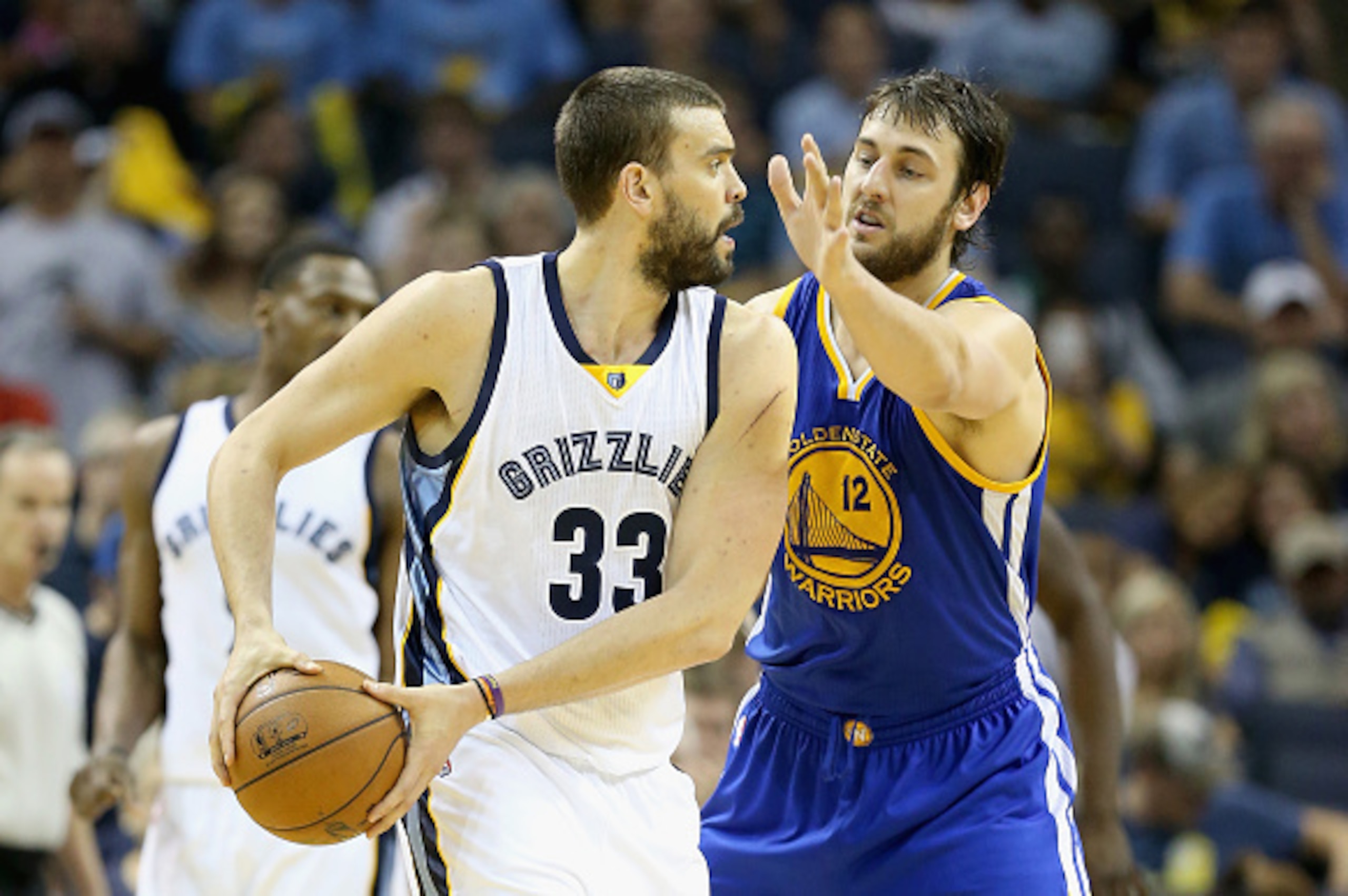 MEMPHIS, TN - MAY 11:  Marc Gasol #33 of the Memphis Grizzlies looks to pass the ball while defended by Andrew Bogut #12 of the Golden State Warriors during Game four of the Western Conference Semifinals of the 2015 NBA Playoffs at FedExForum on May 11, 2