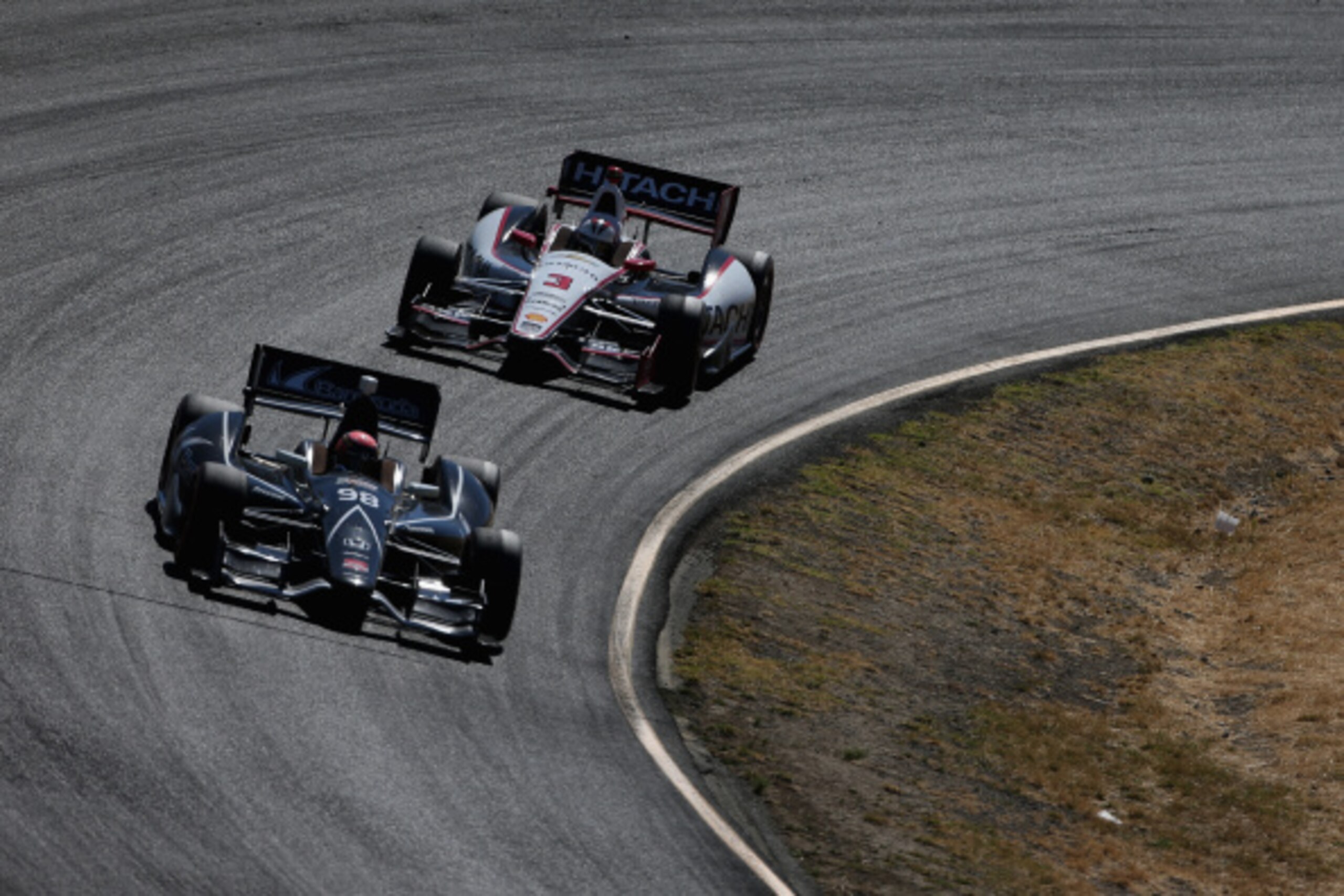 SONOMA, CA - AUGUST 24:  Jack Hawksworth of England, driver of the #98 BHA/BBM with Curb-Agajanian Honda, races Helio Castroneves of Brazil, driver of the #3 Hitachi Team Penske Chevrolet, during the Verizon IndyCar Series GoPro Grand Prix of Sonoma at So