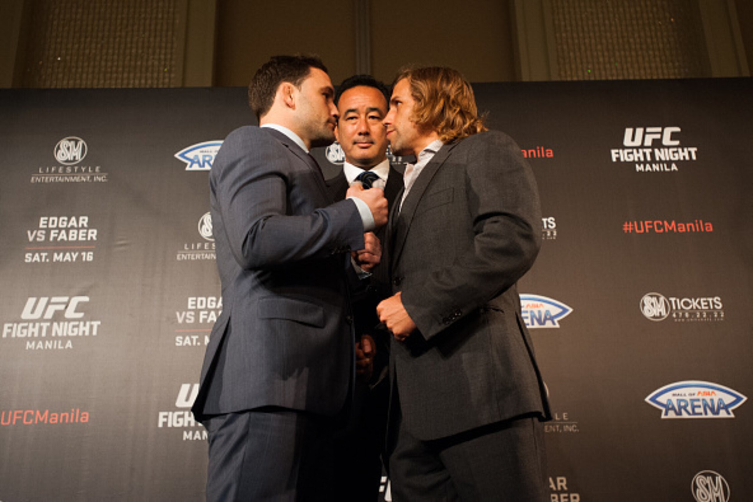 MANILA, PHILIPPINES - MARCH 10:  UFC Asia executive vice president Kenneth Berger stand in the middle of featherweights Frankie Edgar and Uriah Faber during their face off at the UFC Manila Press Conference on March 10, 2015 in Manila, Philippines.  (Phot