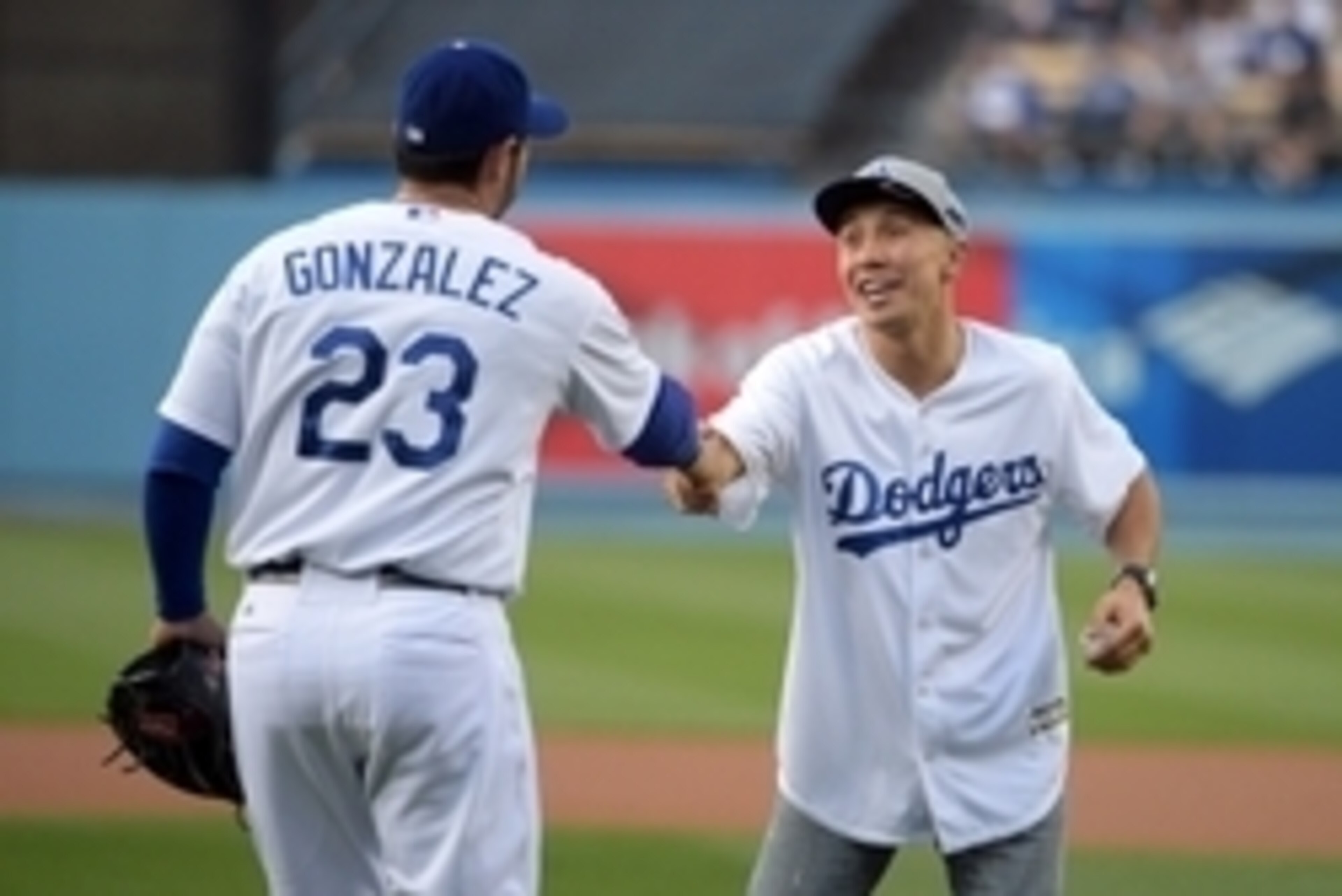 May 11, 2015; Los Angeles, CA, USA; Professional boxer Gennady Golovkin shakes hands with Los Angeles Dodgers first baseman Adrian Gonzalez (23) after throwing out the ceremonial first pitch before the game against the Miami Marlins at Dodger Stadium. Man May 11, 2015; Los Angeles, CA, USA; Professional boxer Gennady Golovkin shakes hands with Los Angeles Dodgers first baseman Adrian Gonzalez (23) after throwing out the ceremonial first pitch before the game against the Miami Marlins at Dodger Stadium. Man