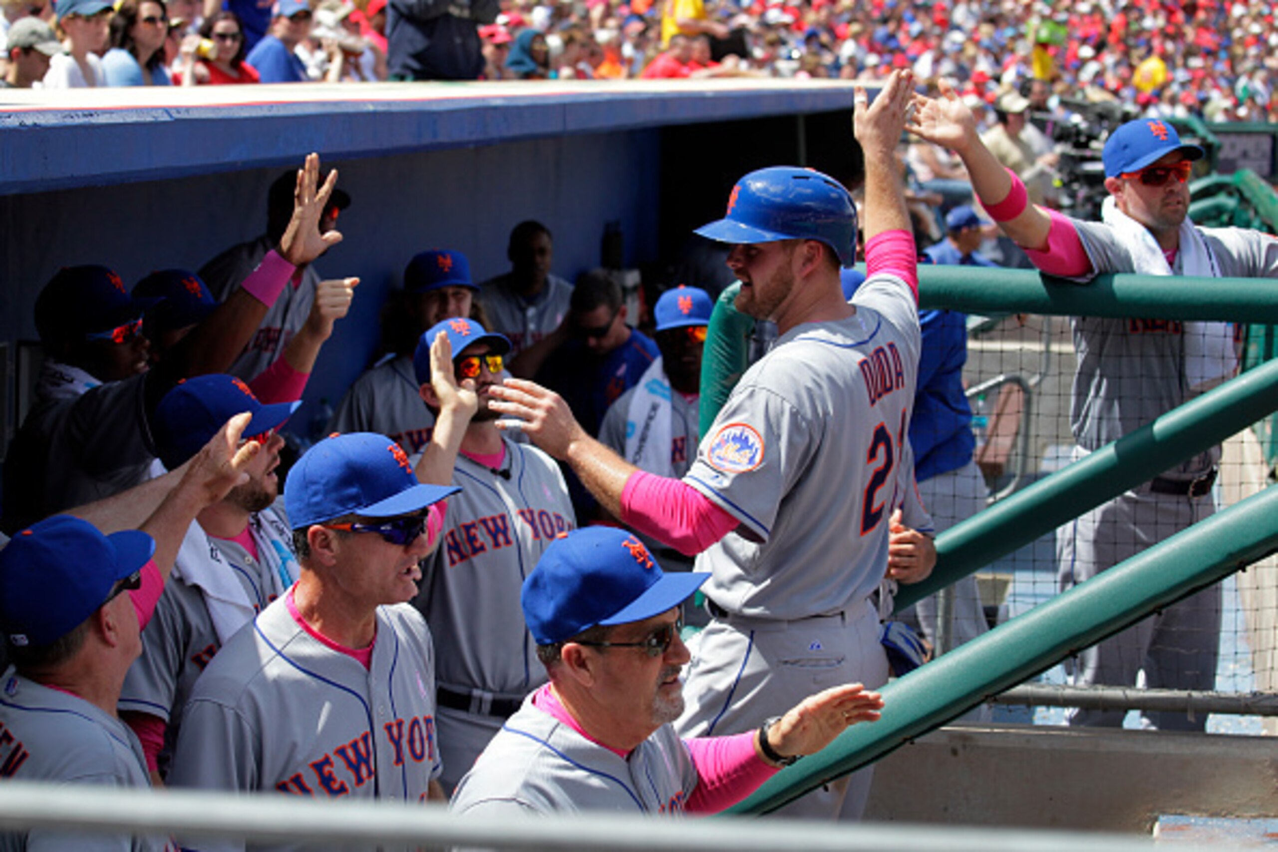 PHILADELPHIA - MAY 10: Lucas Duda #21 of the New York Mets is greeted by teammates in the dugout after scoring a run in the fourth inning during a game against the Philadelphia Phillies at Citizens Bank Park on May 10, 2015 in Philadelphia, Pennsylvania. 