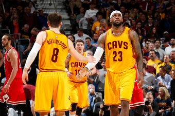 CLEVELAND, OHIO - MAY 6: Matthew Dellavedova #8 and LeBron James #23 of the Cleveland Cavaliers high five during Game Two of the Eastern Conference Semifinals against the Chicago Bulls during the NBA Playoffs on May 6, 2015 at Quicken Loans Arena in Cleve