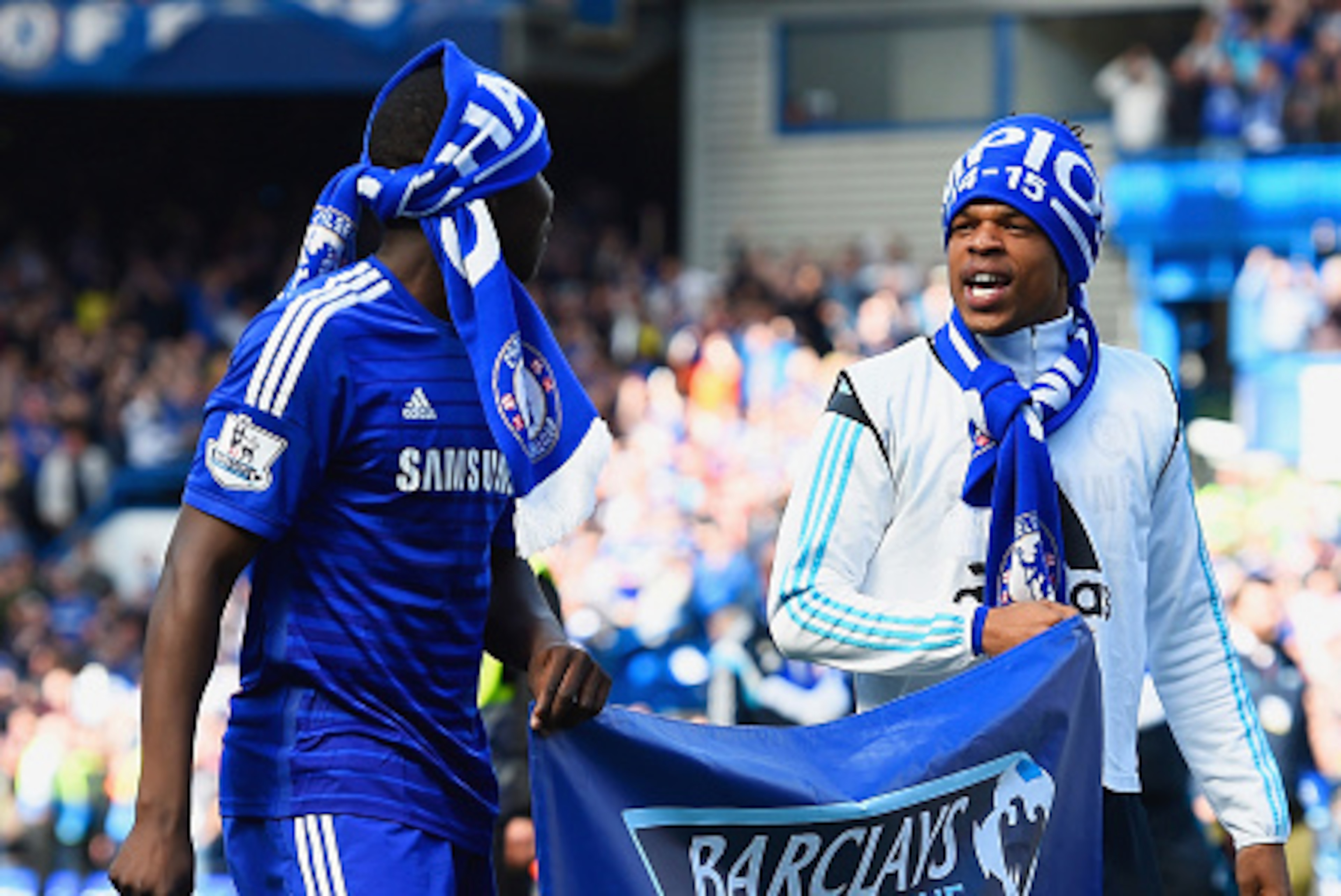 LONDON, ENGLAND - MAY 03:  Kurt Zouma (L) and Loic Remy of Chelsea celebrate winning the Premier League title after the Barclays Premier League match between Chelsea and Crystal Palace at Stamford Bridge on May 3, 2015 in London, England. Chelsea became c