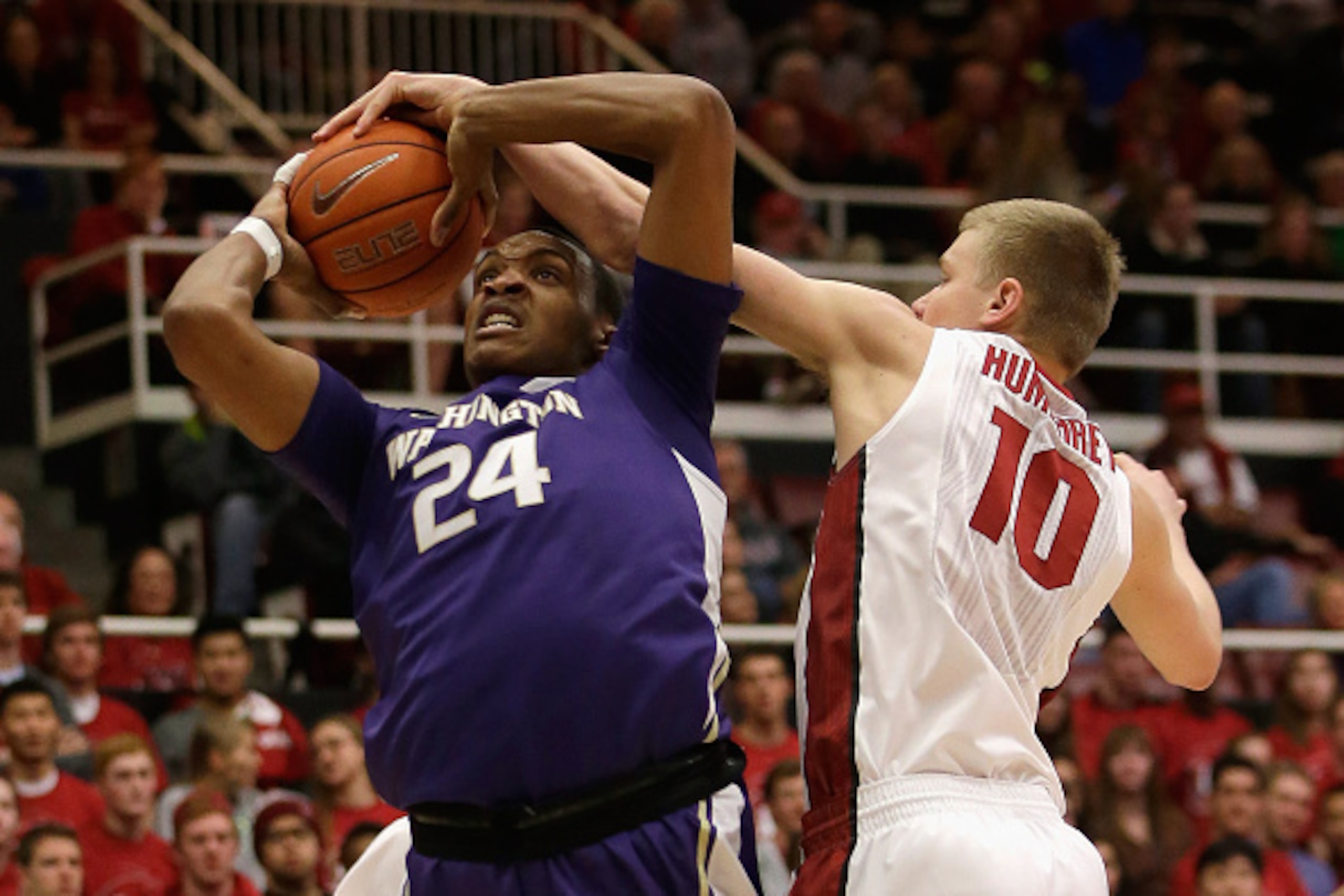 PALO ALTO, CA - JANUARY 04:  Michael Humphrey #10 of the Stanford Cardinal blocks a shot taken by Robert Upshaw #24 of the Washington Huskies at Maples Pavilion on January 4, 2015 in Palo Alto, California.  (Photo by Ezra Shaw/Getty Images)
