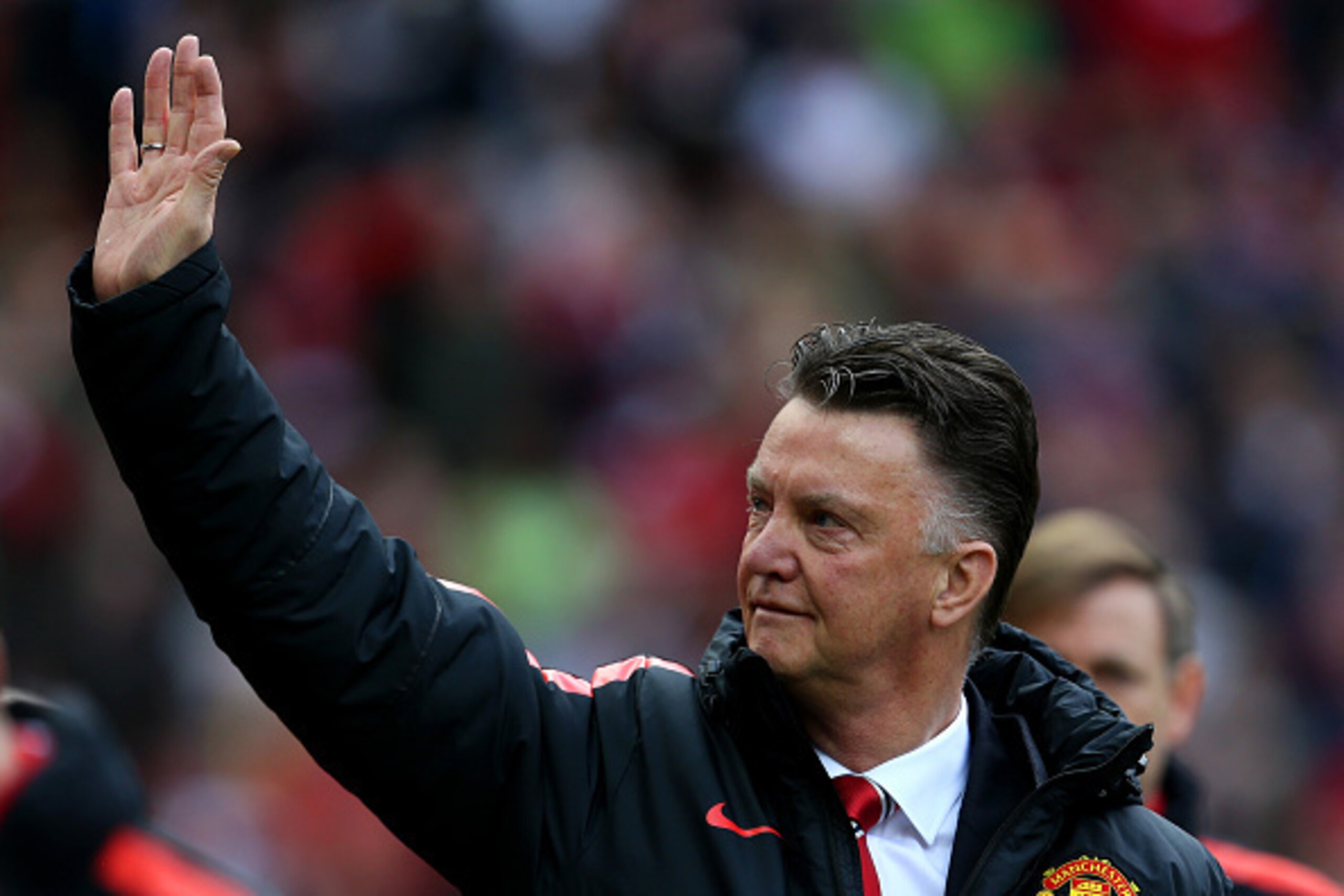 MANCHESTER, ENGLAND - APRIL 04:  Louis van Gaal, manager of Manchester United waves to the fans as he walks out for the Barclays Premier League match between Manchester United and Aston Villa at Old Trafford on April 4, 2015 in Manchester, England.  (Phot
