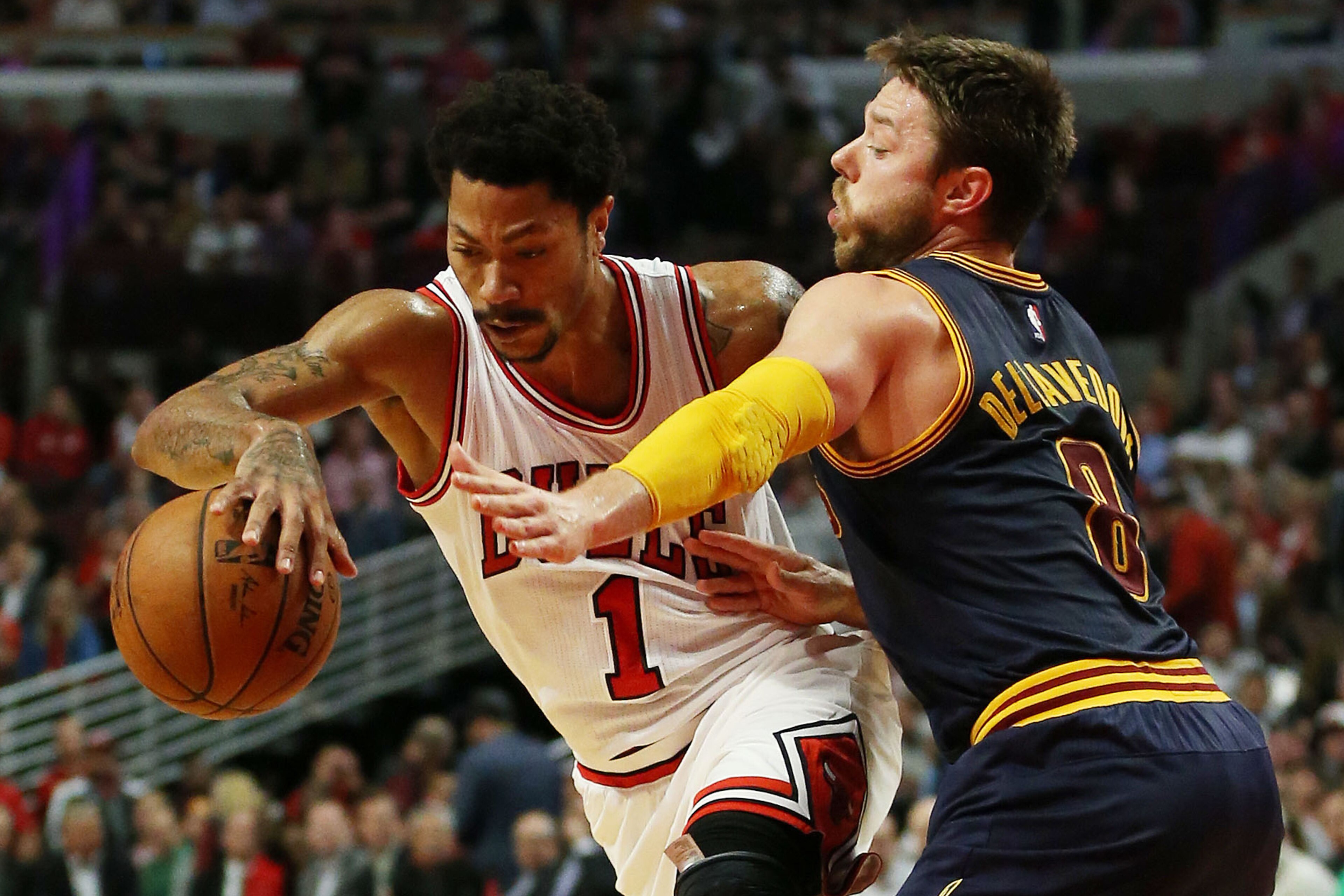 CHICAGO, IL - MAY 14:  Derrick Rose #1 of the Chicago Bulls drives against Matthew Dellavedova #8 of the Cleveland Cavaliers in the third quarter during Game Six of the Eastern Conference Semifinals of the 2015 NBA Playoffs at United Center on May 14, 201