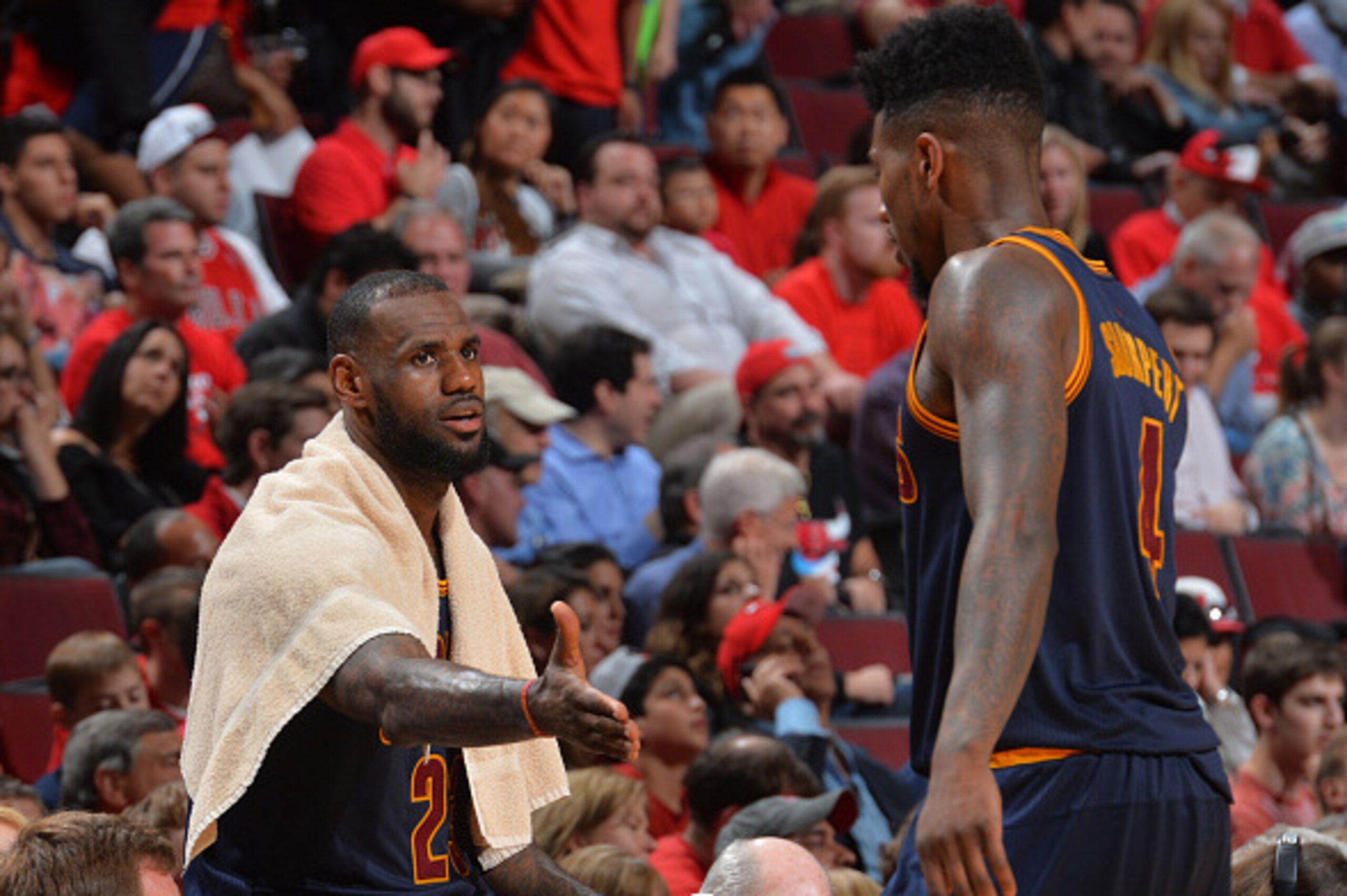 CHICAGO,IL :  LeBron James #23 and Iman Shumpert #4 of the Cleveland Cavaliers shake hands against the Chicago Bulls at the United Center During Game Six of the Eastern Conference Semifinals during the 2015 NBA Playoffs on May 14, 2015 in Chicago,Illinois