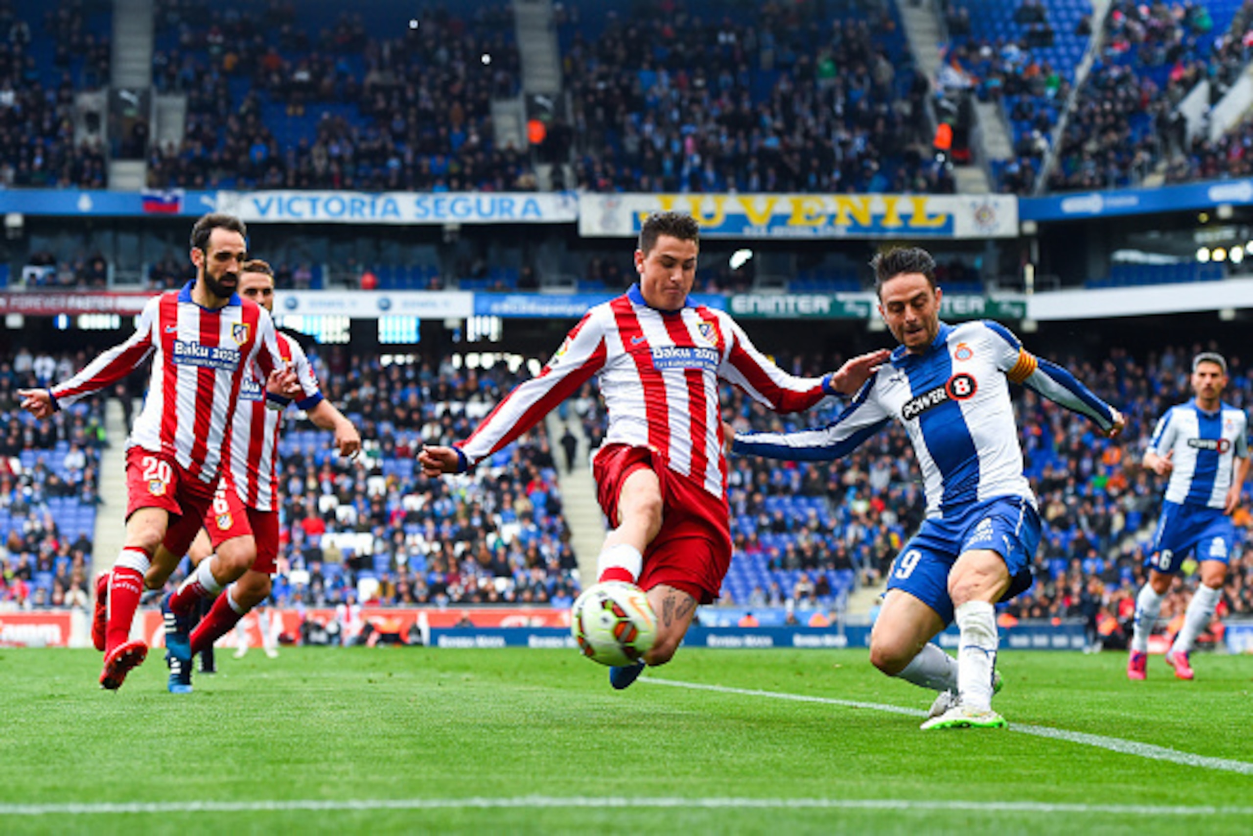 BARCELONA, SPAIN - MARCH 14:  Sergio Garcia of RCD Espanyol competes for the ball with Jose Maria Gimenez of Atletico de Madrid during the La Liga match between RCD Espanyol and Club Atletico de Madrid at Power 8 Stadium on March 14, 2015 in Barcelona, Sp