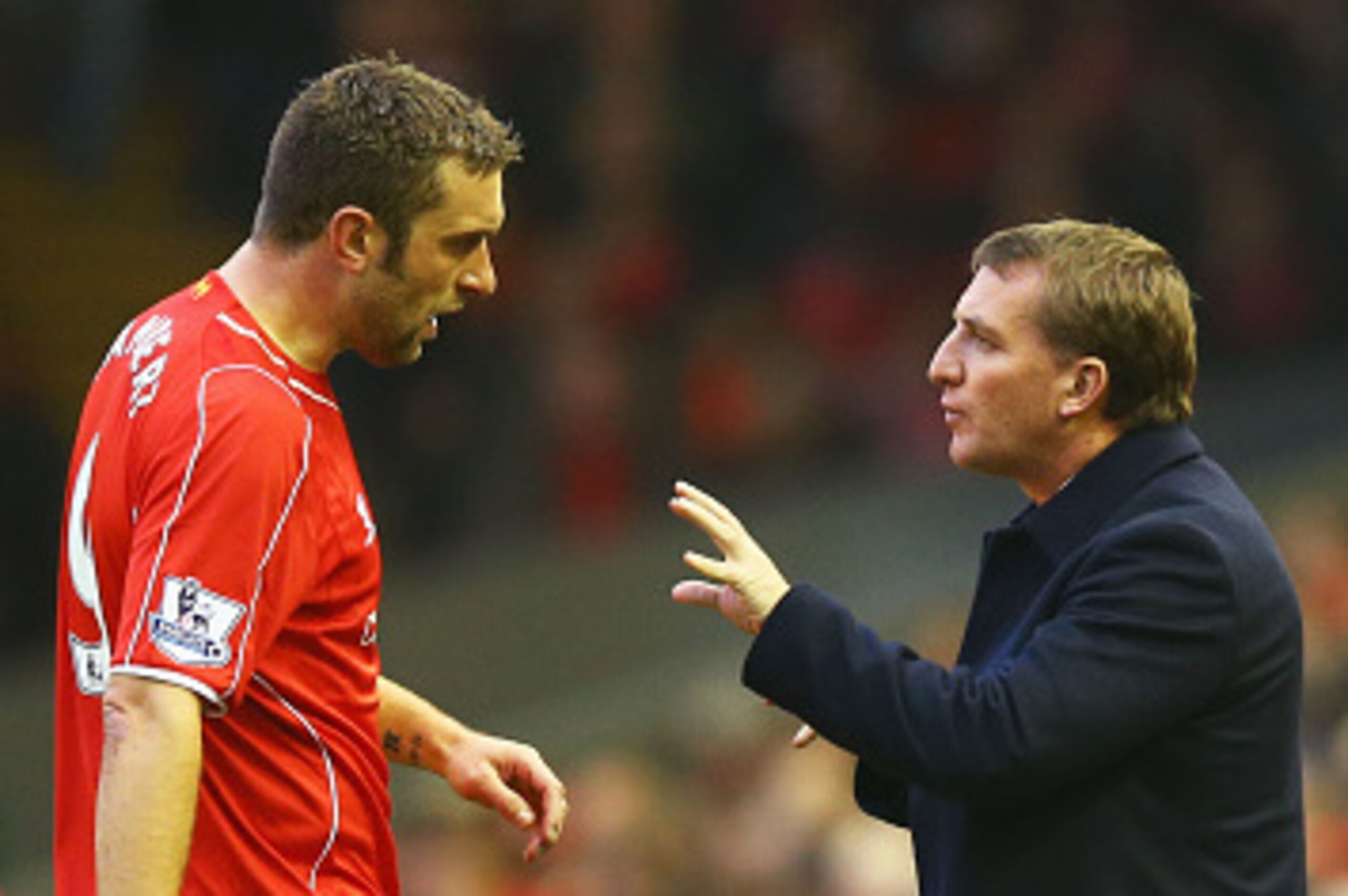 LIVERPOOL, ENGLAND - NOVEMBER 29:  Brendan Rodgers manager of Liverpool talks to Rickie Lambert of Liverpool during the Barclays Premier League match between Liverpool and Stoke City at Anfield on November 29, 2014 in Liverpool, England.  (Photo by Richar
