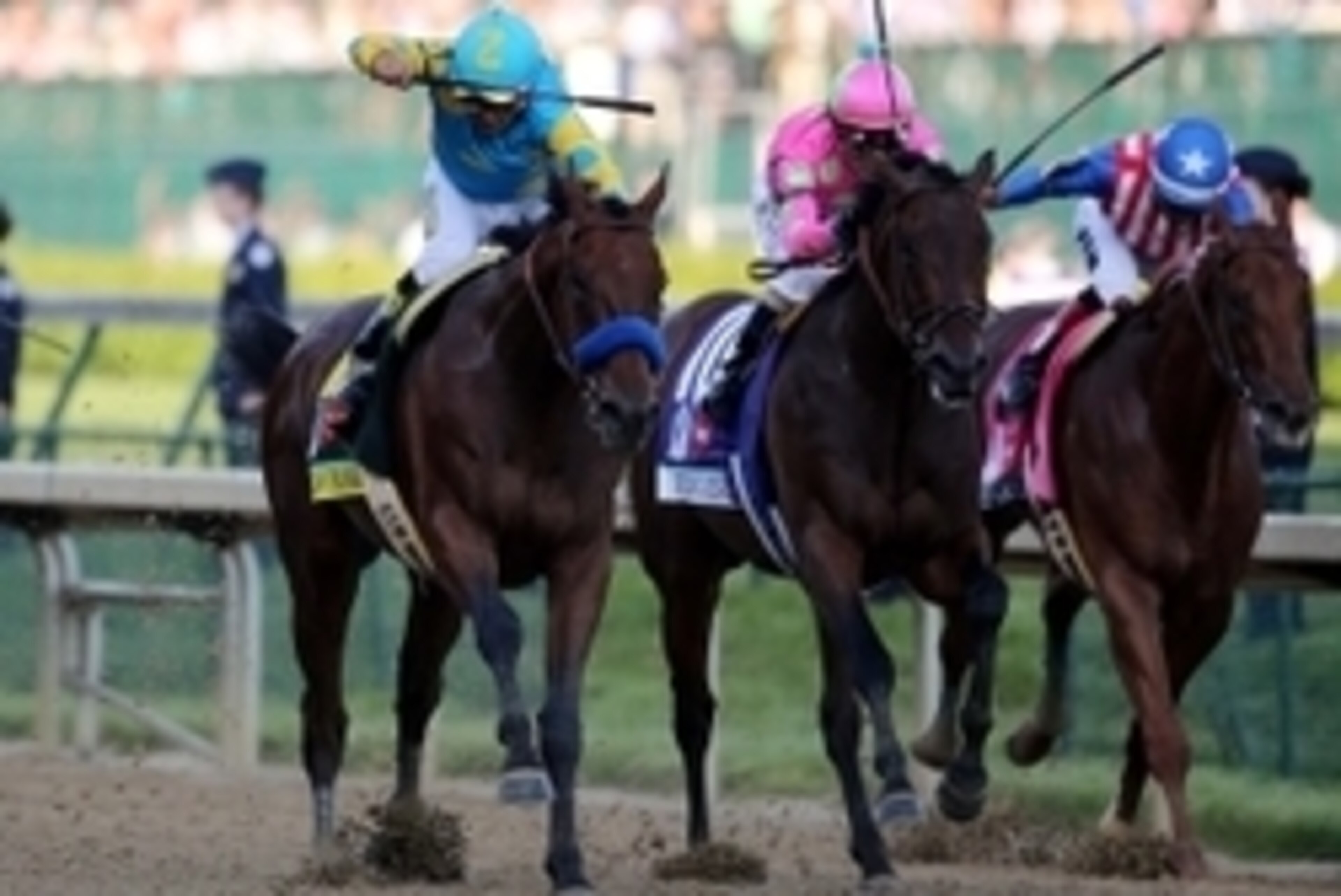 May 2, 2015; Louisville, KY, USA; Victor Espinoza aboard American Pharoah passes Gary L Stevens aboard Firing Line during the 141st Kentucky Derby at Churchill Downs. Mandatory Credit: Mark Zerof-USA TODAY Sports