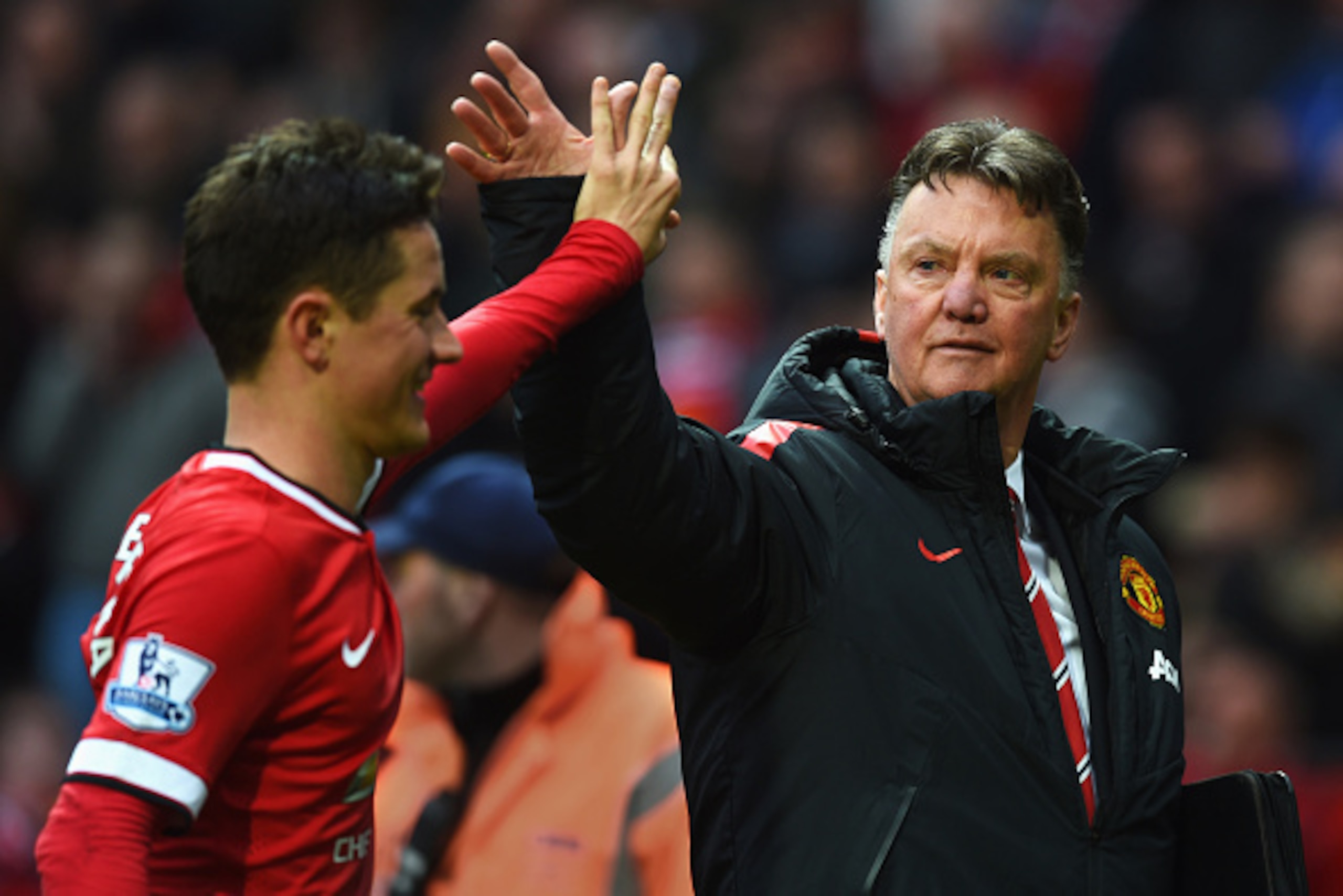 MANCHESTER, ENGLAND - APRIL 12:  Louis van Gaal manager of Manchester United celebrates victory with Ander Herrera after the Barclays Premier League match between Manchester United and Manchester City at Old Trafford on April 12, 2015 in Manchester, Engla