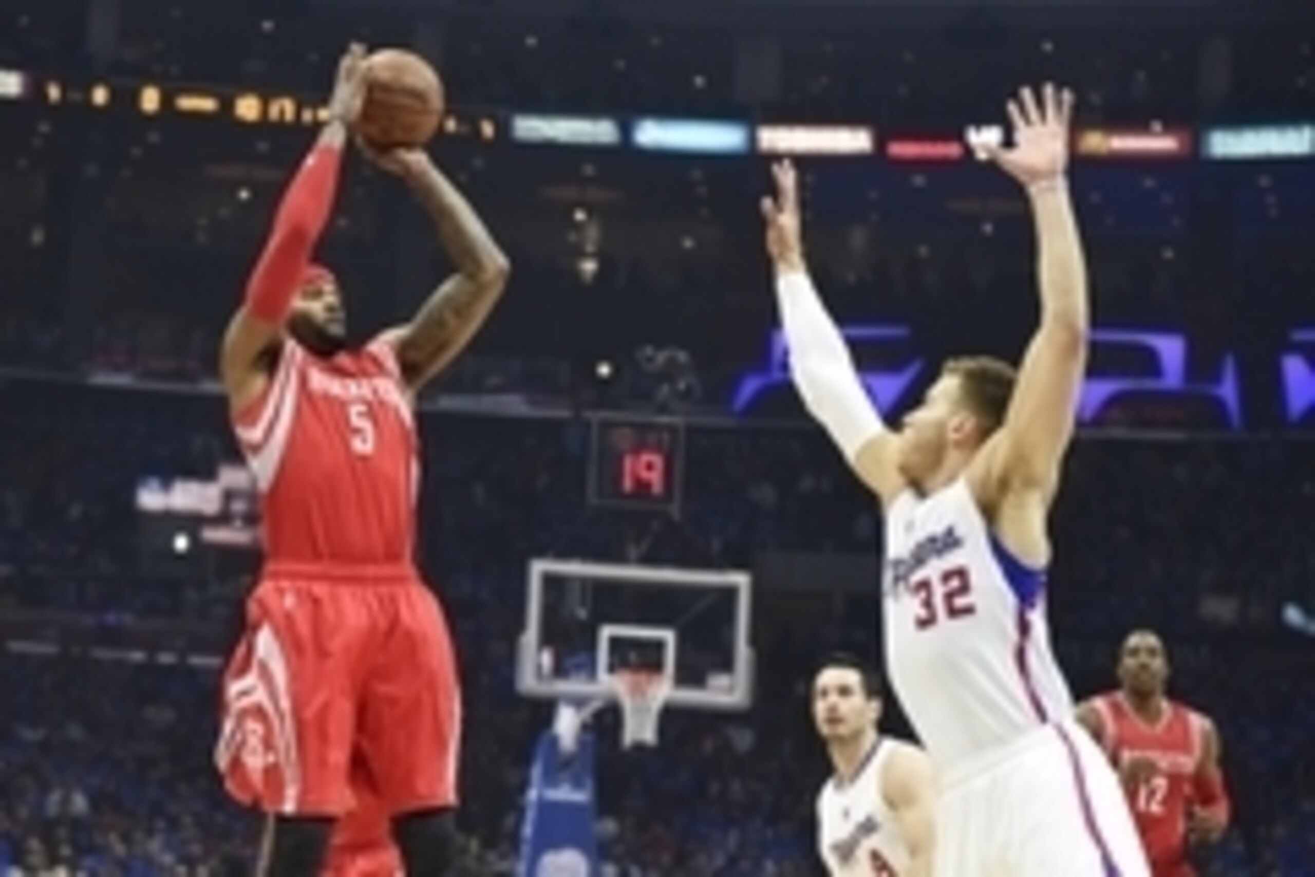 May 14, 2015; Los Angeles, CA, USA; Houston Rockets forward Josh Smith (5) shoots over Los Angeles Clippers forward Blake Griffin (32) in game six of the second round of the NBA Playoffs at Staples Center. Mandatory Credit: Richard Mackson-USA TODAY Sport