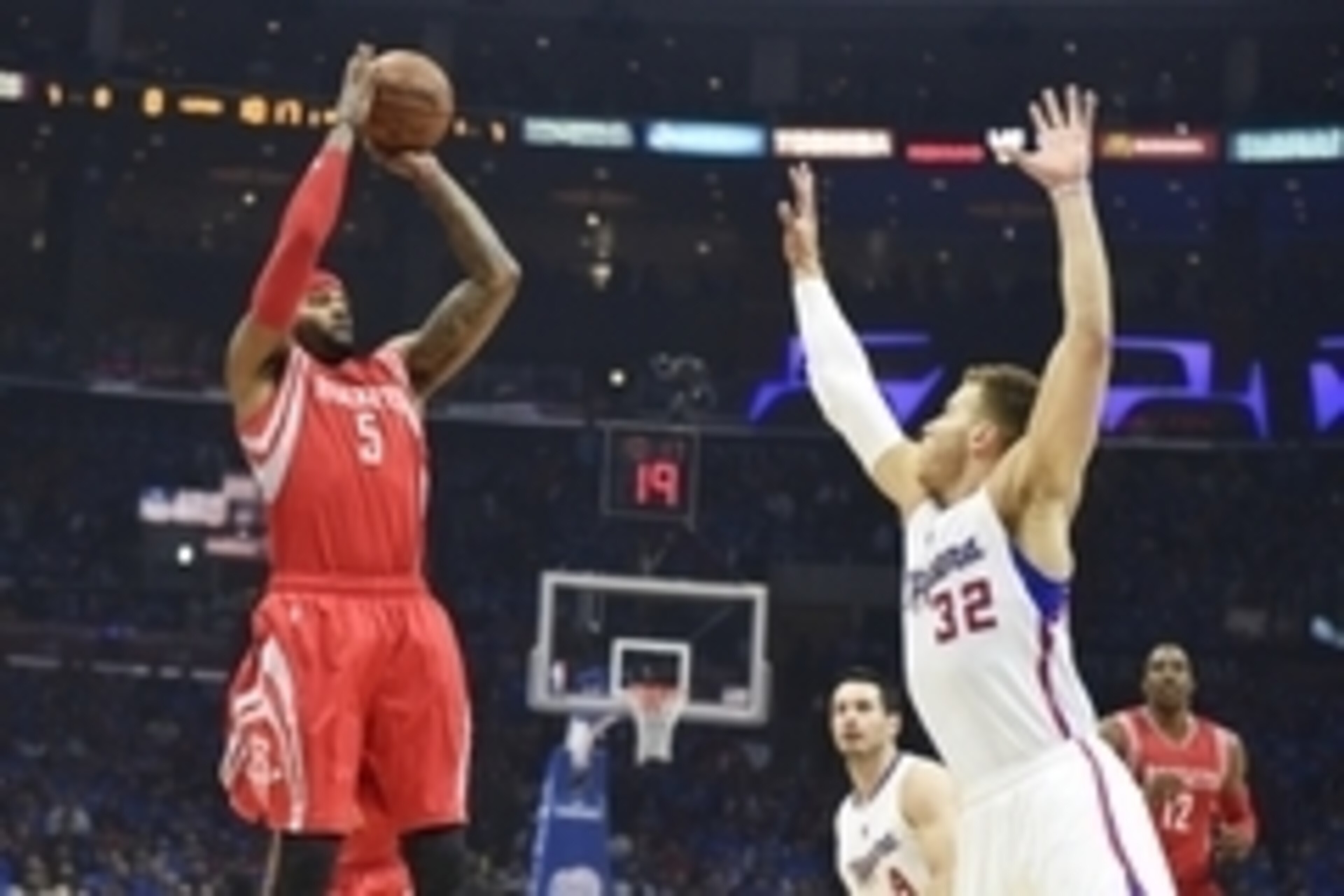 May 14, 2015; Los Angeles, CA, USA; Houston Rockets forward Josh Smith (5) shoots over Los Angeles Clippers forward Blake Griffin (32) in game six of the second round of the NBA Playoffs at Staples Center. Mandatory Credit: Richard Mackson-USA TODAY Sport