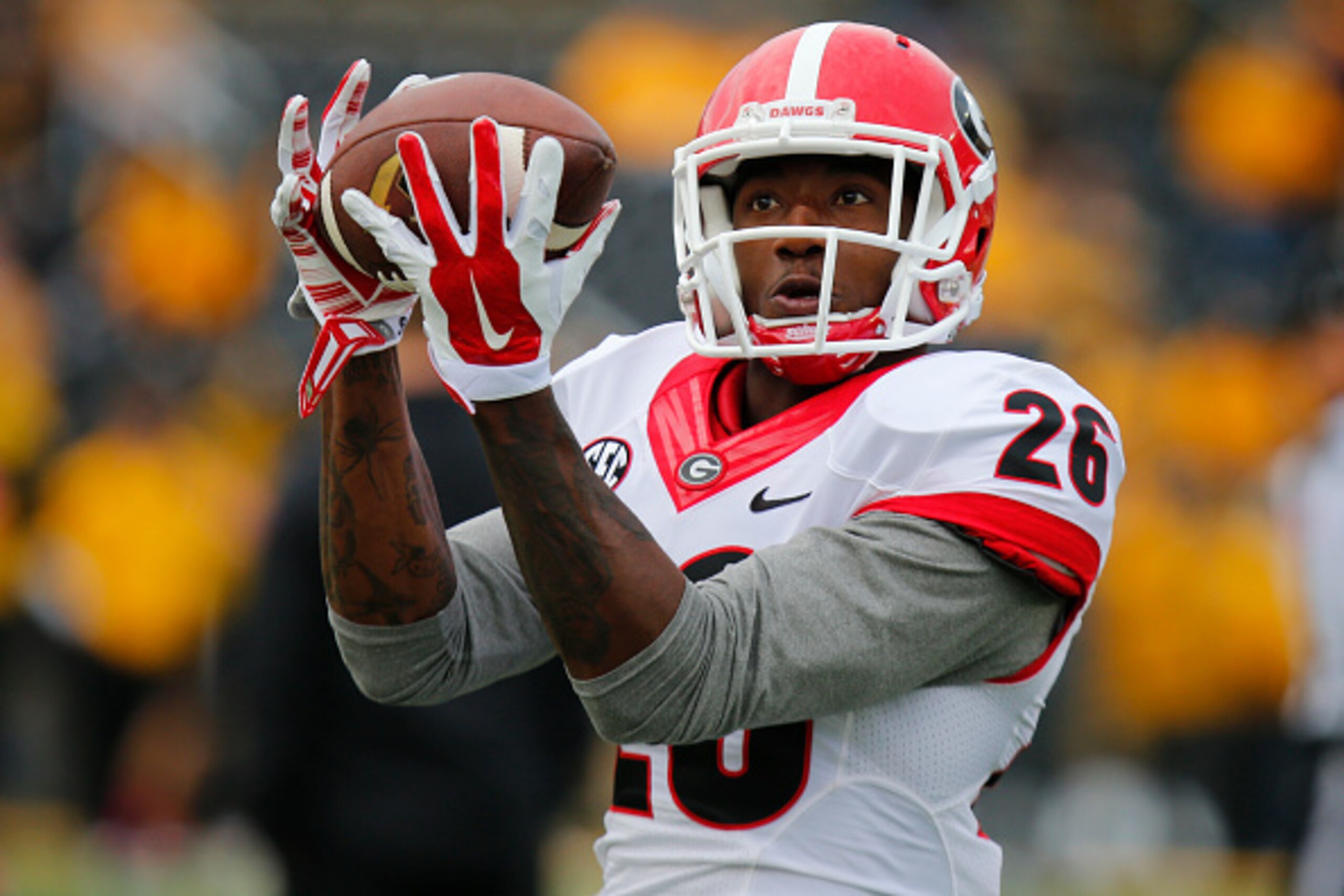 COLUMBIA, MO - OCTOBER 11:  Malcolm Mitchell #26 of the Georgia Bulldogs makes a catch during pre game warmups before taking on the Missouri Tigers on October 11, 2014 at Faurot Field/Memorial Stadium in Columbia, Missouri. (Photo by Kyle Rivas/Getty Imag