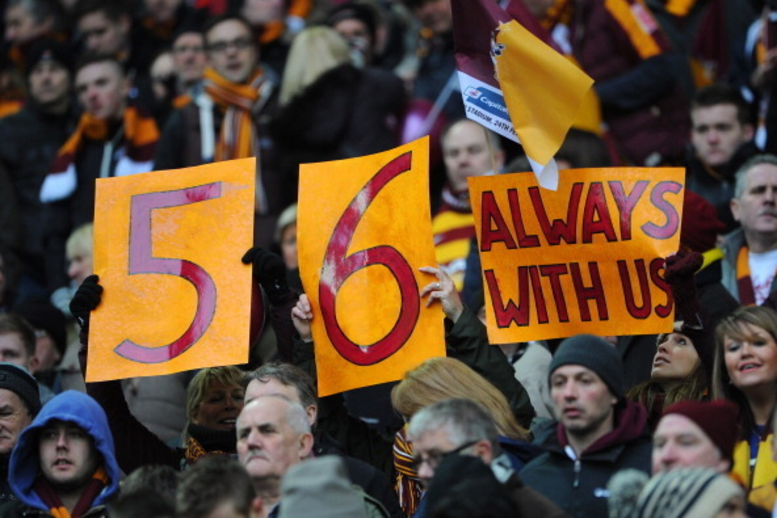 LONDON, ENGLAND - FEBRUARY 24:  Bradford City fans pay tribute to the 56 fans who died the Bradford City stadium fire in 1985 during the Capital One Cup Final match between Bradford City and Swansea City at Wembley Stadium on February 24, 2013 in London, 