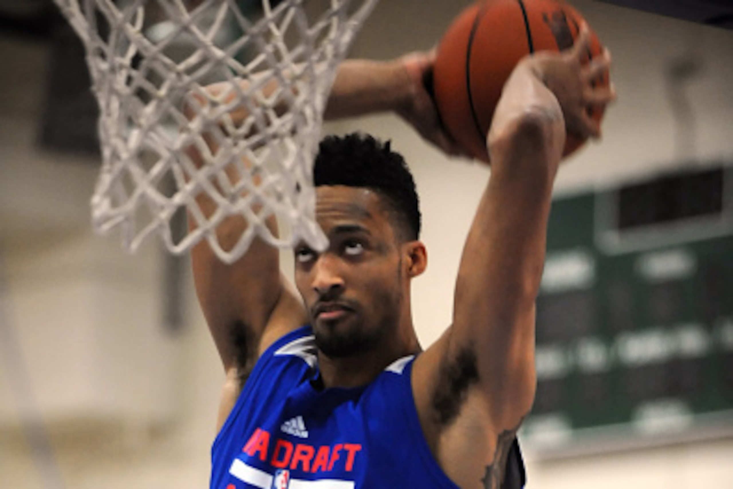 CHICAGO, IL - MAY 14:  J.P. Tokoto #15 goes for a dunk during the 2015 NBA Draft Combine on May 14, 2015 at Quest Multiplex in Chicago, Illinois. NOTE TO USER: User expressly acknowledges and agrees that, by downloading and/or using this photograph, user 