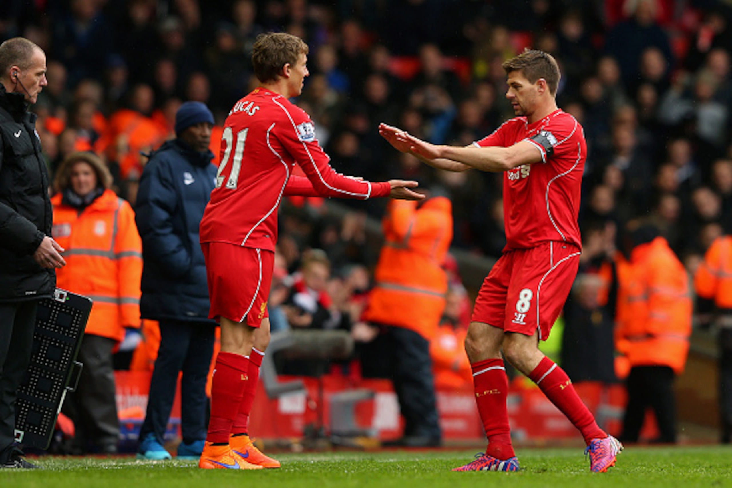 LIVERPOOL, ENGLAND - MAY 02: Steven Gerrard of Liverpool shakes hands with Lucas Leiva as he is replaced during the Barclays Premier League match between Liverpool and Queens Park Rangers at Anfield on May 2, 2015 in Liverpool, England. (Photo by Alex Li LIVERPOOL, ENGLAND - MAY 02: Steven Gerrard of Liverpool shakes hands with Lucas Leiva as he is replaced during the Barclays Premier League match between Liverpool and Queens Park Rangers at Anfield on May 2, 2015 in Liverpool, England. (Photo by Alex Li