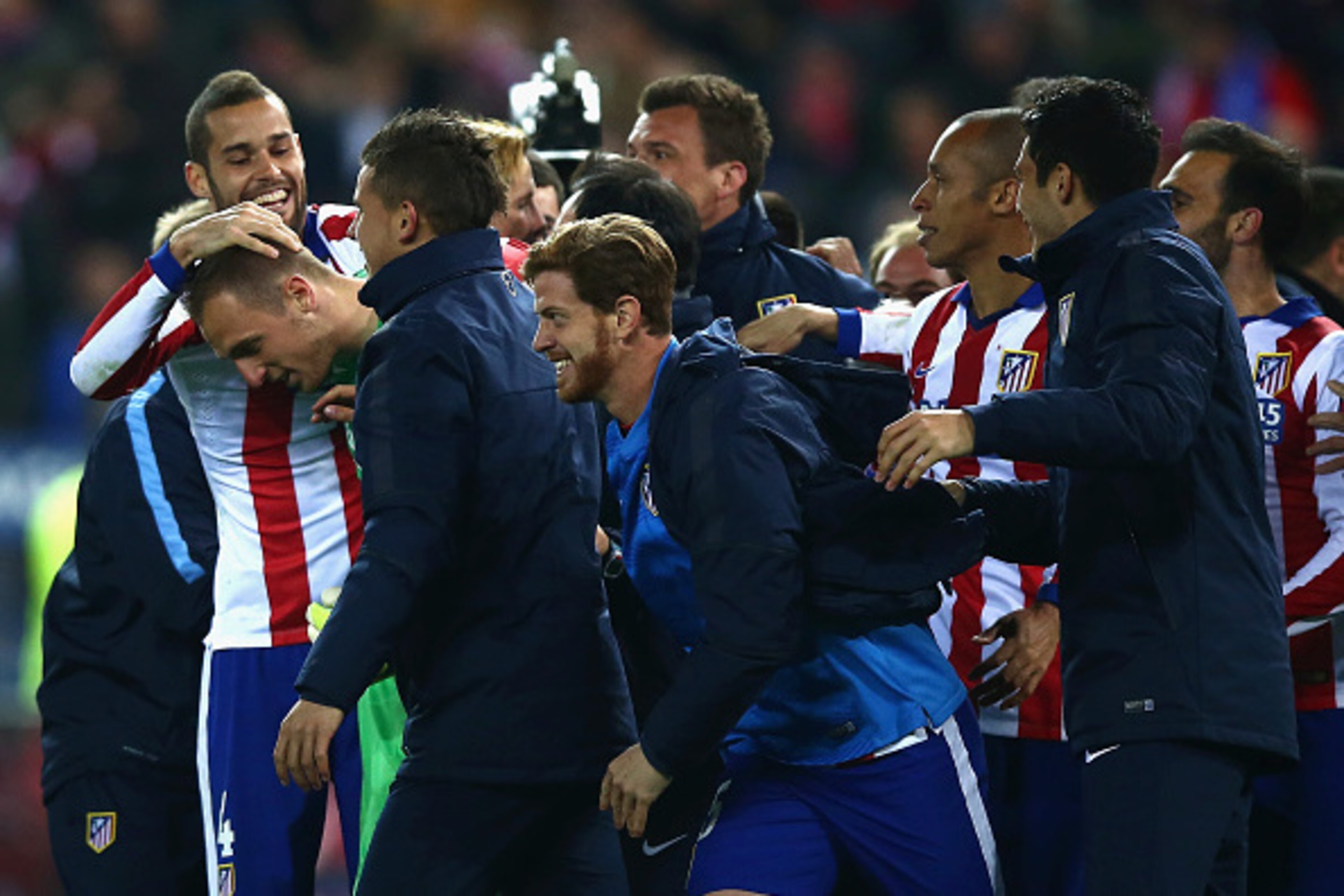 MADRID, SPAIN - MARCH 17:  Jan Oblak of Atletico Madrid is mobbed by team mates after the penalty shoot out during the UEFA Champions League round of 16 match between Club Atletico de Madrid and Bayer 04 Leverkusen at Vicente Calderon Stadium on March 17,