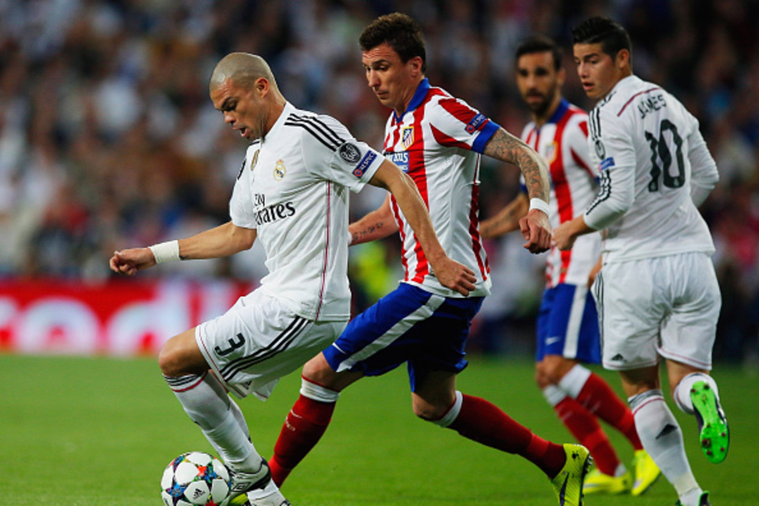 MADRID, SPAIN - APRIL 22: Pepe of Real Madrid CF is chased by Mario Mandzukic of Atletico Madrid during the UEFA Champions League quarter-final second leg match between Real Madrid CF and Club Atletico de Madrid at Bernabeu on April 22, 2015 in Madrid, S MADRID, SPAIN - APRIL 22: Pepe of Real Madrid CF is chased by Mario Mandzukic of Atletico Madrid during the UEFA Champions League quarter-final second leg match between Real Madrid CF and Club Atletico de Madrid at Bernabeu on April 22, 2015 in Madrid, S