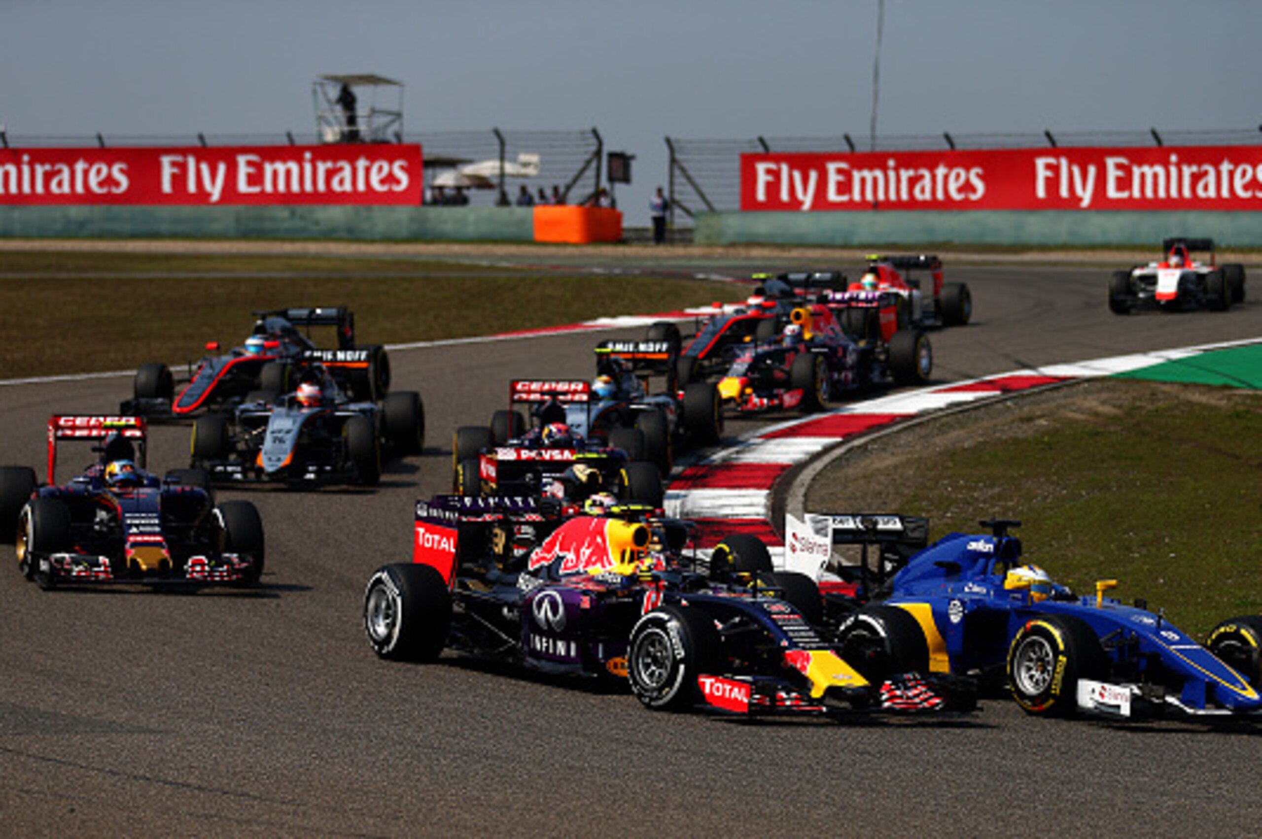 SHANGHAI, CHINA - APRIL 12:  Daniil Kvyat of Russia and Infiniti Red Bull Racing drives next to Marcus Ericsson of Sweden and Sauber F1 during the Formula One Grand Prix of China at Shanghai International Circuit on April 12, 2015 in Shanghai, China.  (Ph