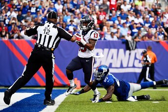 EAST RUTHERFORD, NJ - SEPTEMBER 21:  Damaris Johnson #13 of the Houston Texans scores a 44-yard touchdown against the defense of  Stevie Brown #27 of the New York Giants in the third quarter at MetLife Stadium on September 21, 2014 in East Rutherford, New