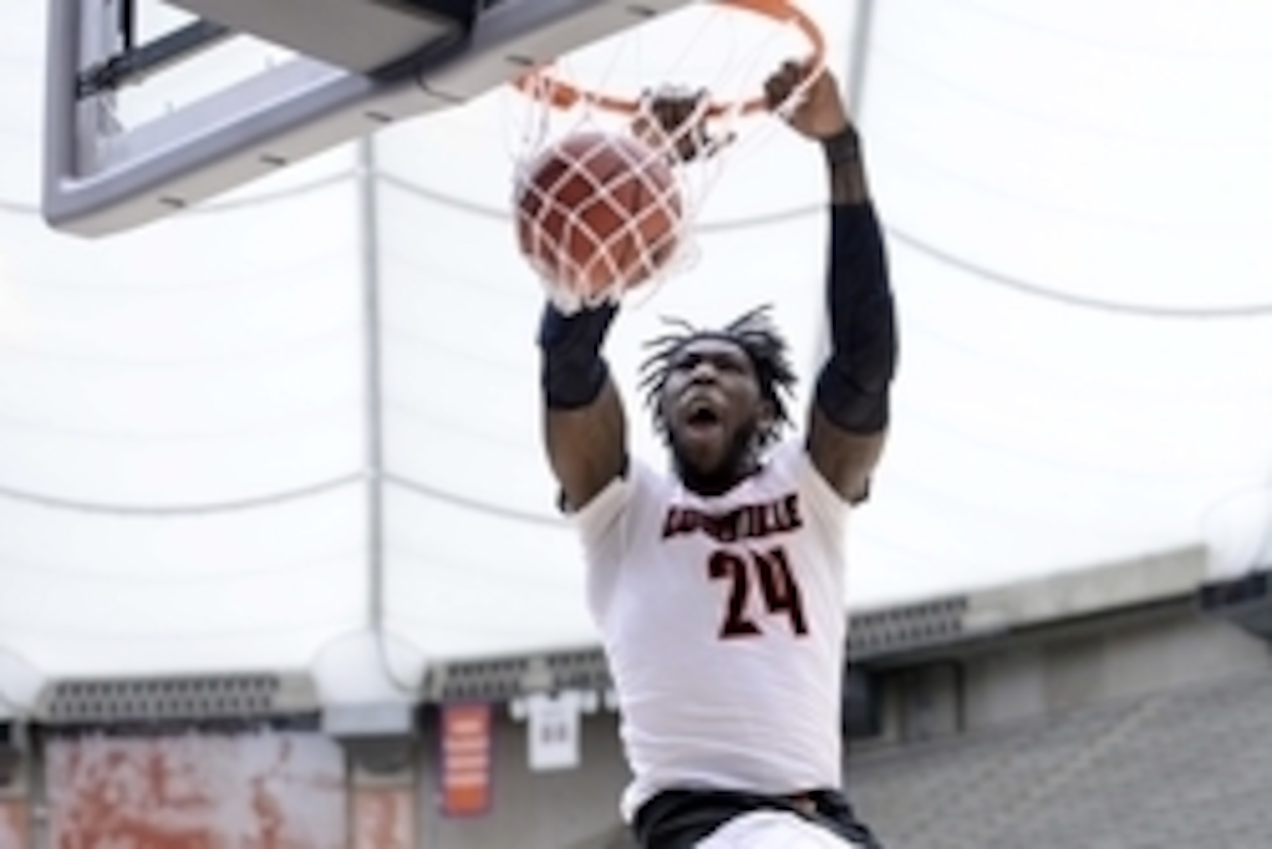 Mar 29, 2015; Syracuse, NY, USA; Louisville Cardinals forward Montrezl Harrell (24) dunks the ball during the first half against the Michigan State Spartans in the finals of the east regional of the 2015 NCAA Tournament at Carrier Dome. Mandatory Credit: 