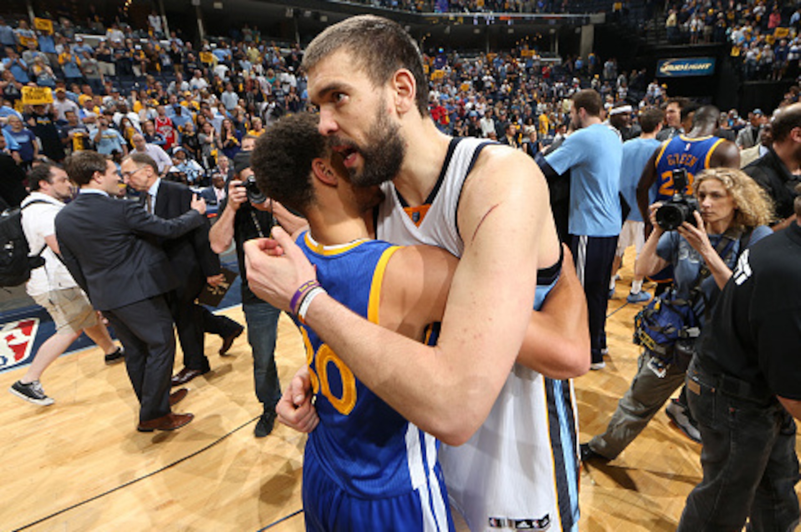 MEMPHIS, TN - MAY 15: Stephen Curry #30 of the Golden State Warriors and Marc Gasol #33 of the Memphis Grizzlies hug after Game Six of the Western Conference Semifinals of the NBA Playoffs at FedExForum on May 15, 2015 in Memphis, Tennessee. NOTE TO USER: