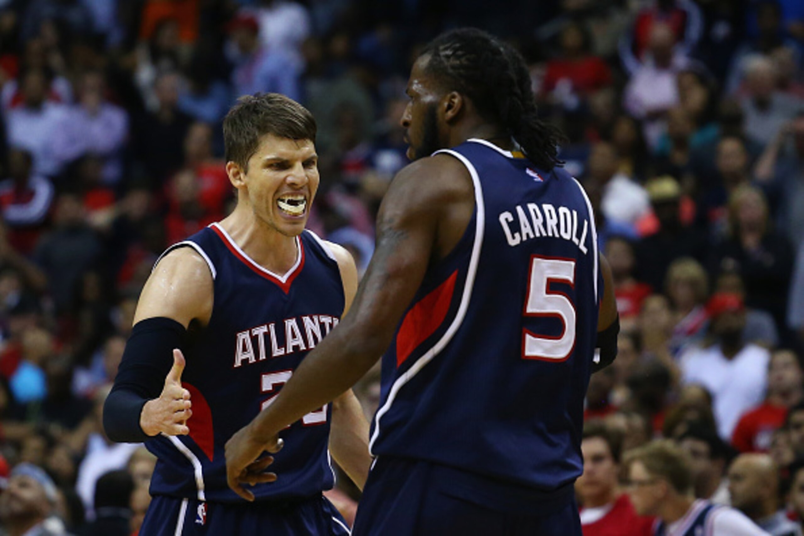 WASHINGTON, DC - MAY 15:  Kyle Korver #26 of the Atlanta Hawks celebrates with DeMarre Carroll #5 during the second half against the Washington Wizards at Verizon Center on May 15, 2015 in Washington, DC. The Hawks defeat the Wizards 94-91.  (Photo by Mad