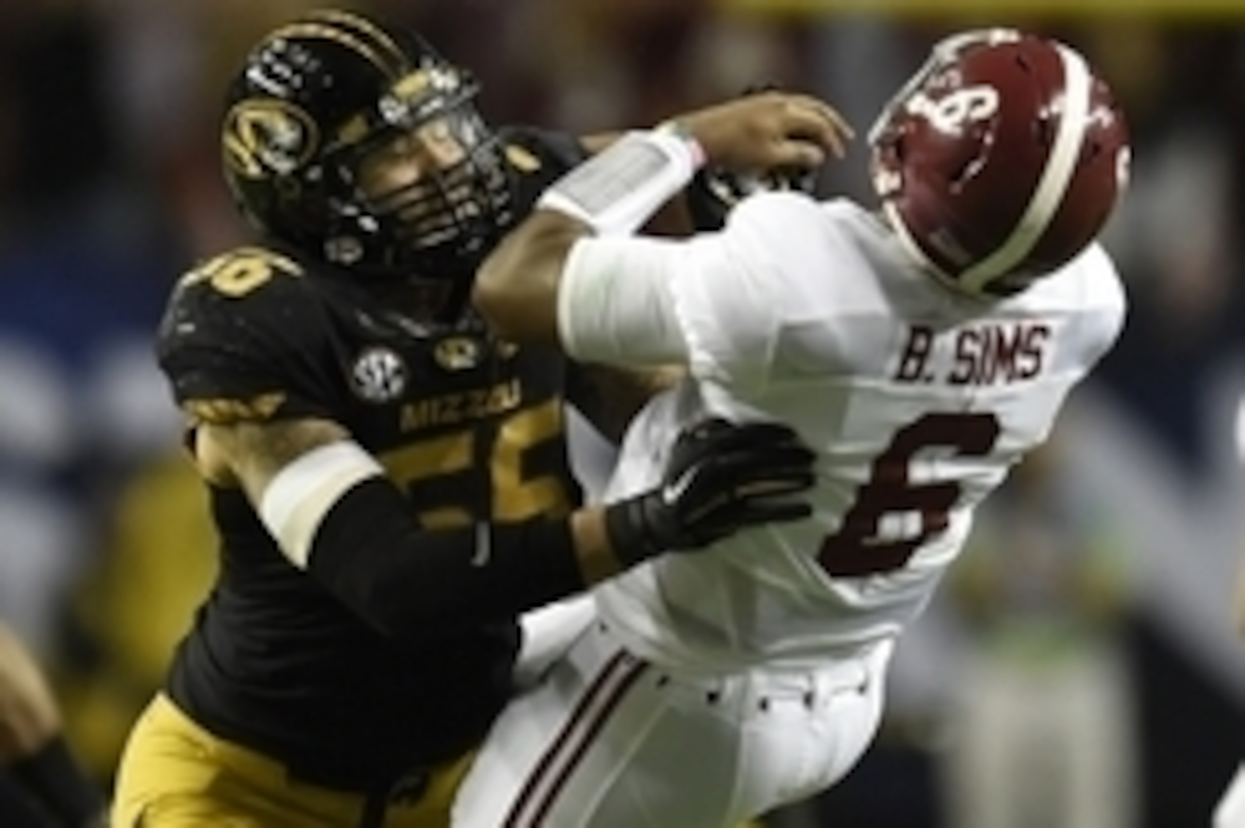 Dec 6, 2014; Atlanta, GA, USA; Missouri Tigers defensive lineman Shane Ray (56) tackles Alabama Crimson Tide quarterback Blake Sims (6) during the second quarter of the 2014 SEC Championship Game at the Georgia Dome. The play caused Ray to be ejected from