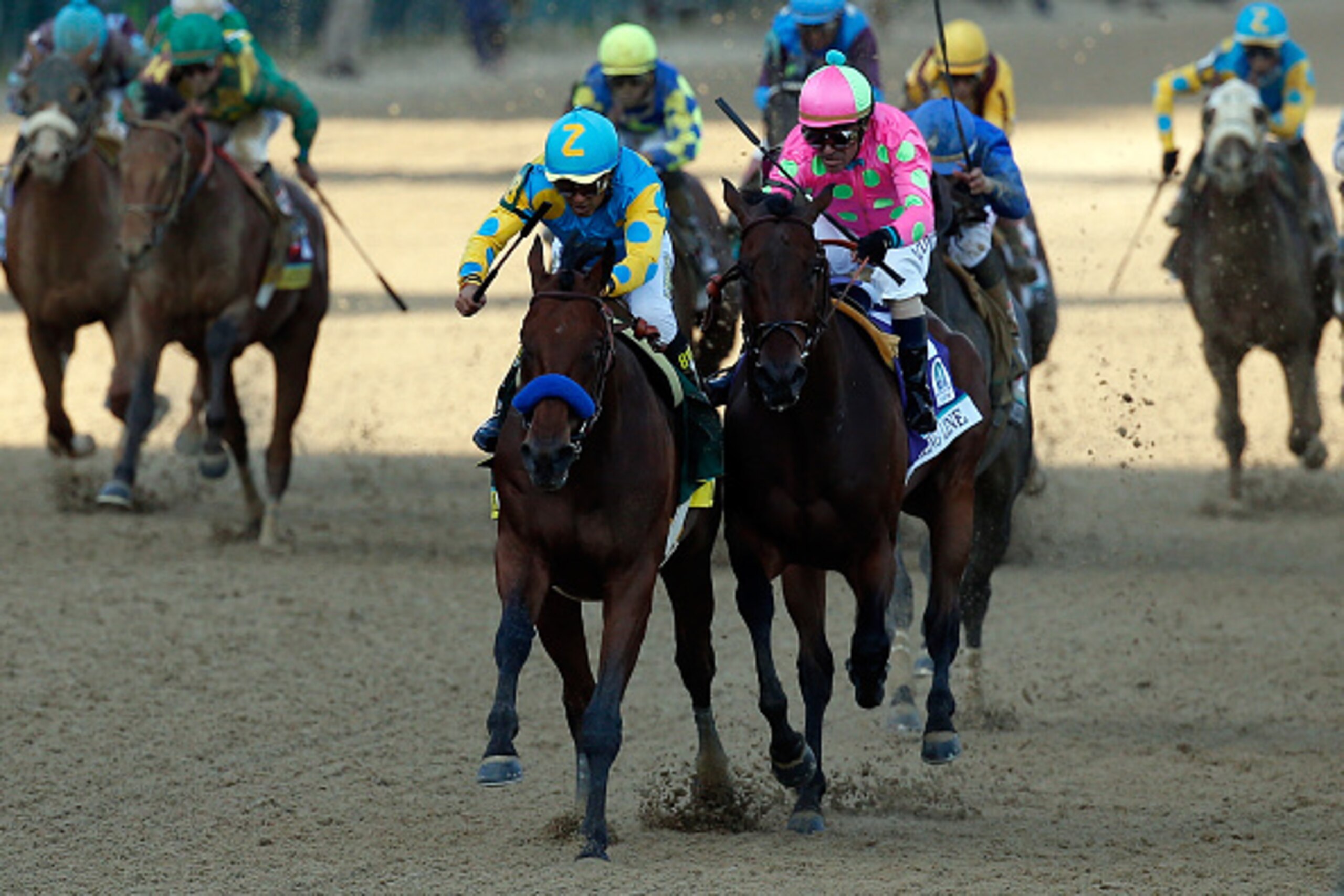 LOUISVILLE, KY - MAY 02: American Pharoah #18, ridden by Victor Espinoza, races Firing Line #10, ridden by Gary Stevens, down the frontstretch to the finish line during the 141st running of the Kentucky Derby at Churchill Downs on May 2, 2015 in Louisvil LOUISVILLE, KY - MAY 02: American Pharoah #18, ridden by Victor Espinoza, races Firing Line #10, ridden by Gary Stevens, down the frontstretch to the finish line during the 141st running of the Kentucky Derby at Churchill Downs on May 2, 2015 in Louisvil