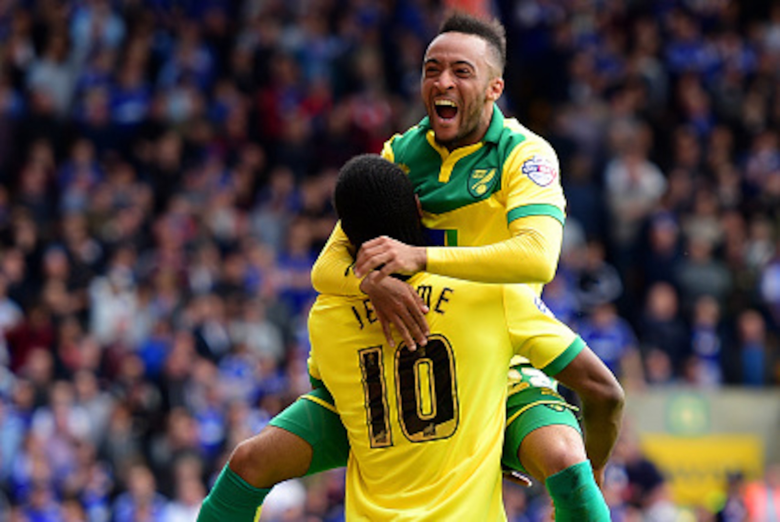 NORWICH, ENGLAND - MAY 16:  Cameron Jerome of Norwich City (10) celebrates with team mate Nathan Redmond as he scores their third goal during the Sky Bet Championship Playoff semi final second leg match between Norwich City and Ipswich Town  at Carrow Roa