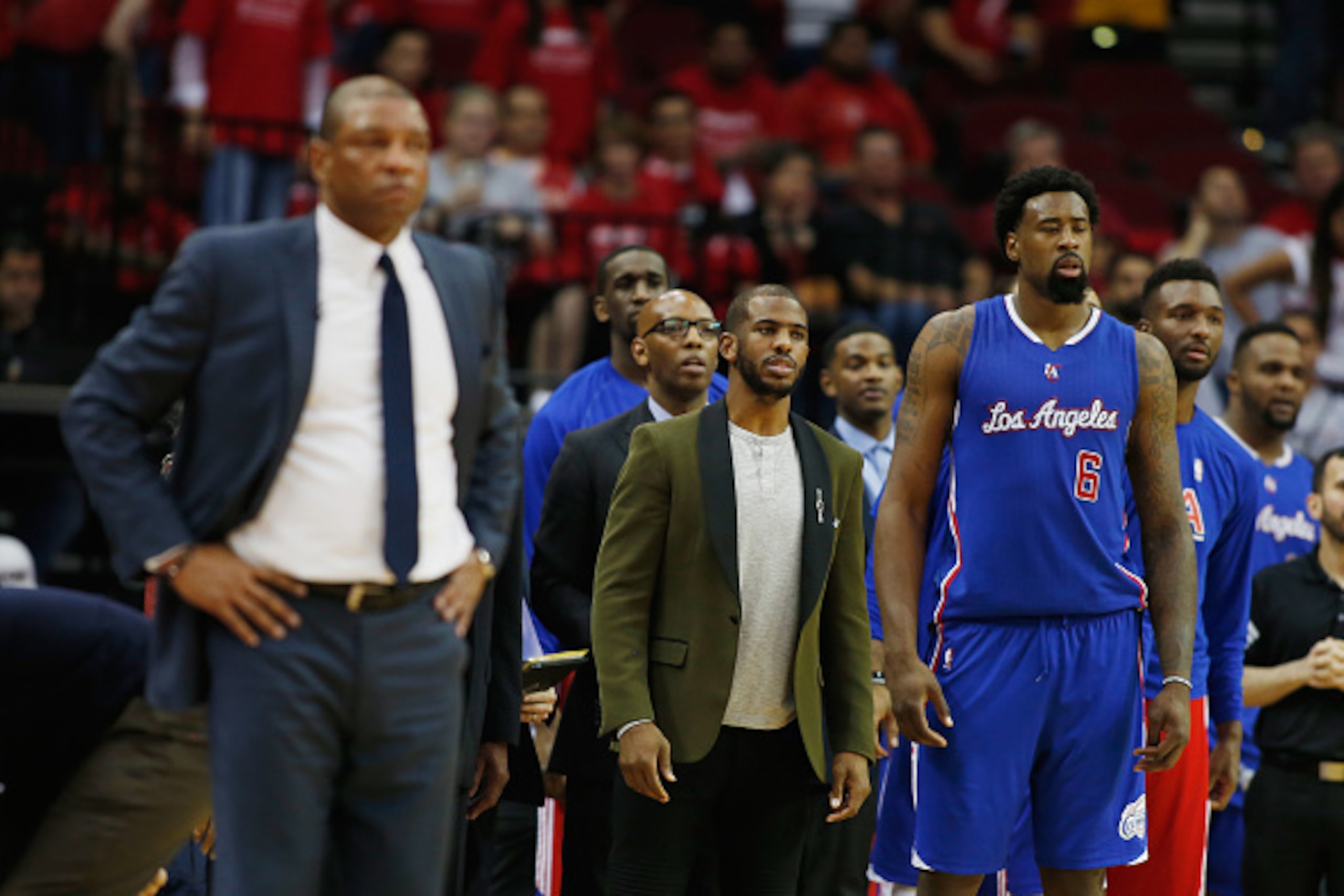 HOUSTON, TX - MAY 04:  Chris Paul #3 of the Los Angeles Clippers (C) waits alongside his coach Doc Rivers and DeAndre Jordan #6 near the bench late in their game against the Houston Rockets during Game One in the Western Conference Semifinals of the 2015 
