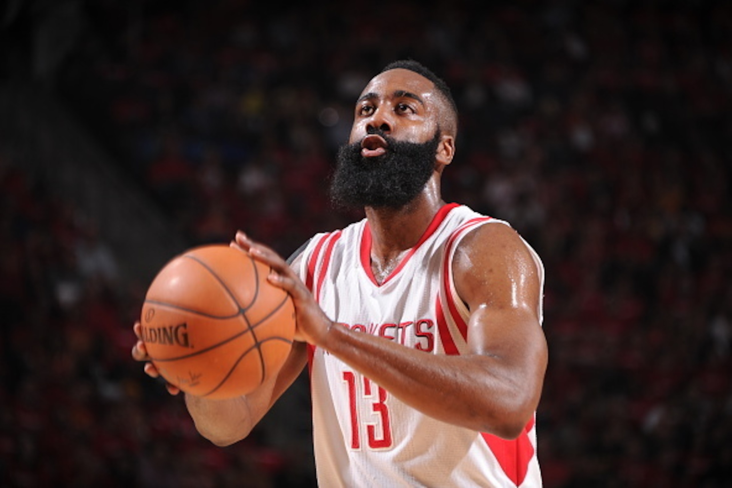 HOUSTON, TX - APRIL 18:  James Harden #13 of the Houston Rockets shoots a free throw against the Dallas Mavericks in Game One of the Western Conference Quarterfinals during the NBA Playoffs on April 18, 2015 at the Toyota Center in Houston, Texas. NOTE TO