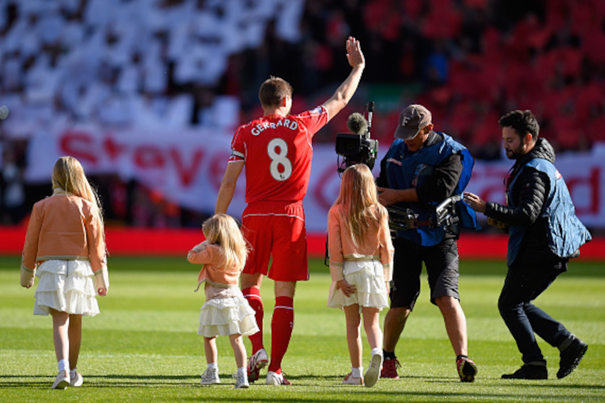 LIVERPOOL, ENGLAND - MAY 16:  Captain Steven Gerrard of Liverpool walks onto the pitch with his daughters Lilly-Ella, Lourdes and Lexie during the Barclays Premier League match between Liverpool and Crystal Palace at Anfield on May 16, 2015 in Liverpool, 