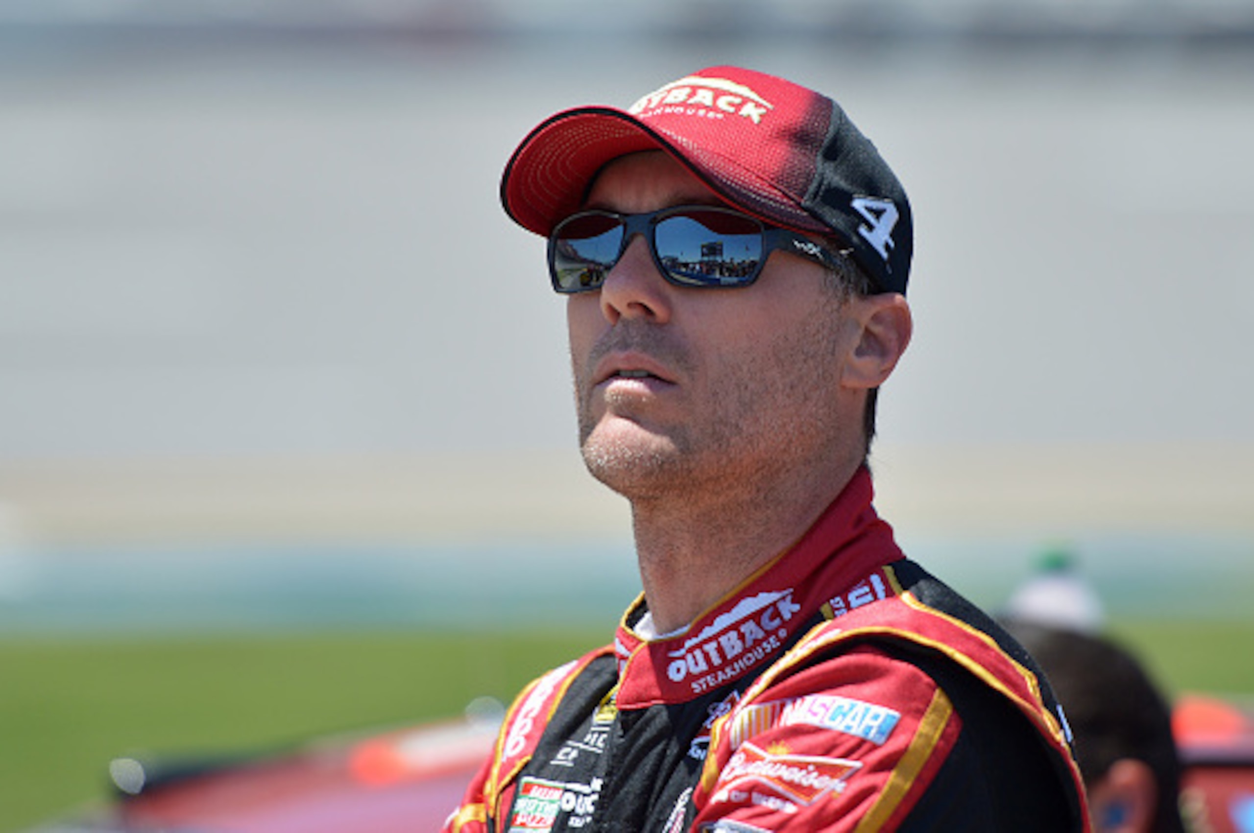 TALLADEGA, AL - MAY 02: Kevin Harvick, driver of the #4 Outback Steakhouse Chevrolet, stands on the grid during qualifying for the NASCAR Sprint Cup Series GEICO 500 at Talladega Superspeedway on May 2, 2015 in Talladega, Alabama.  (Photo by Drew Hallowel