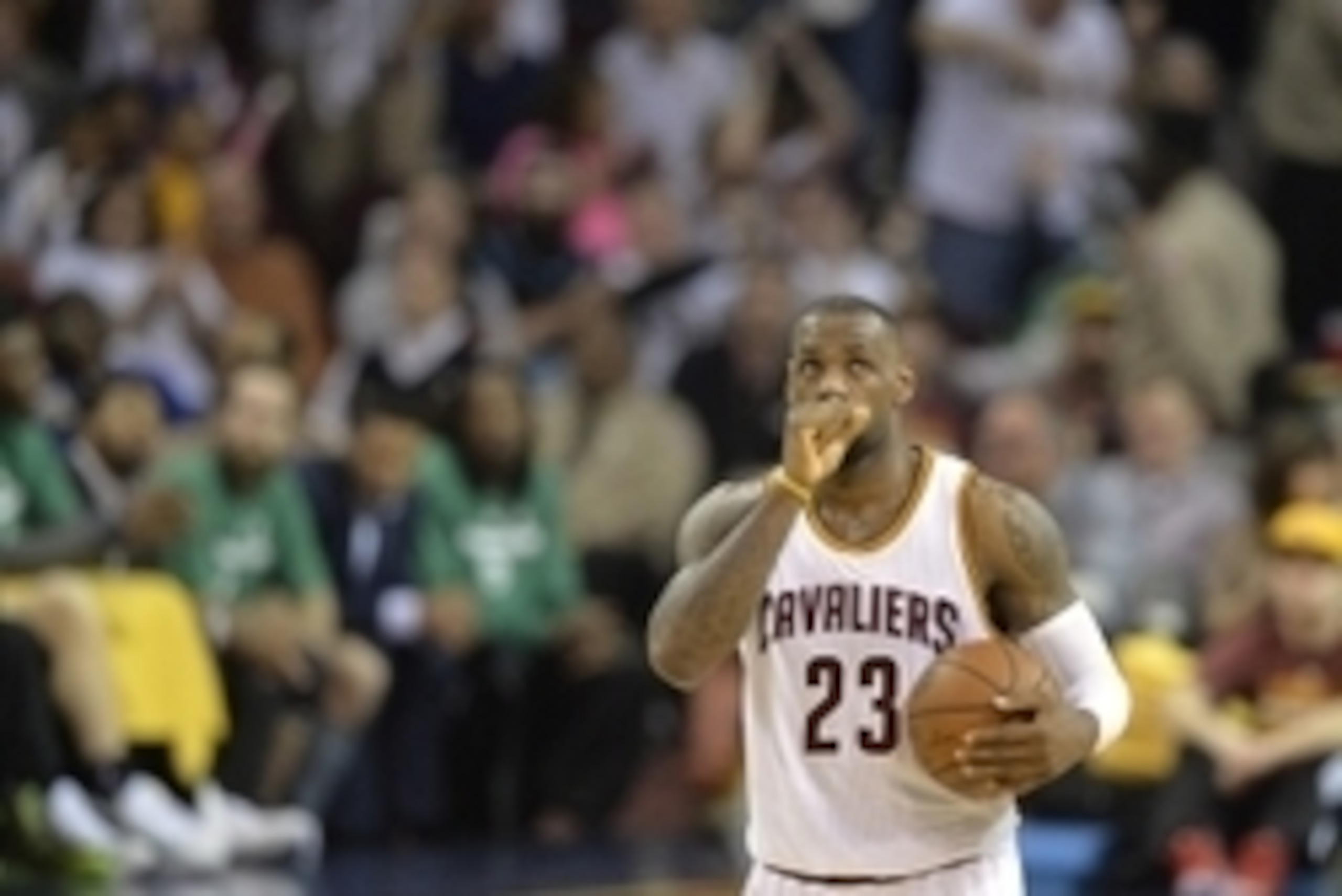 Apr 19, 2015; Cleveland, OH, USA; Cleveland Cavaliers forward LeBron James (23) holds the ball in the fourth quarter against the Boston Celtics in game one of the first round of the NBA Playoffs at Quicken Loans Arena. Mandatory Credit: David Richard-USA 