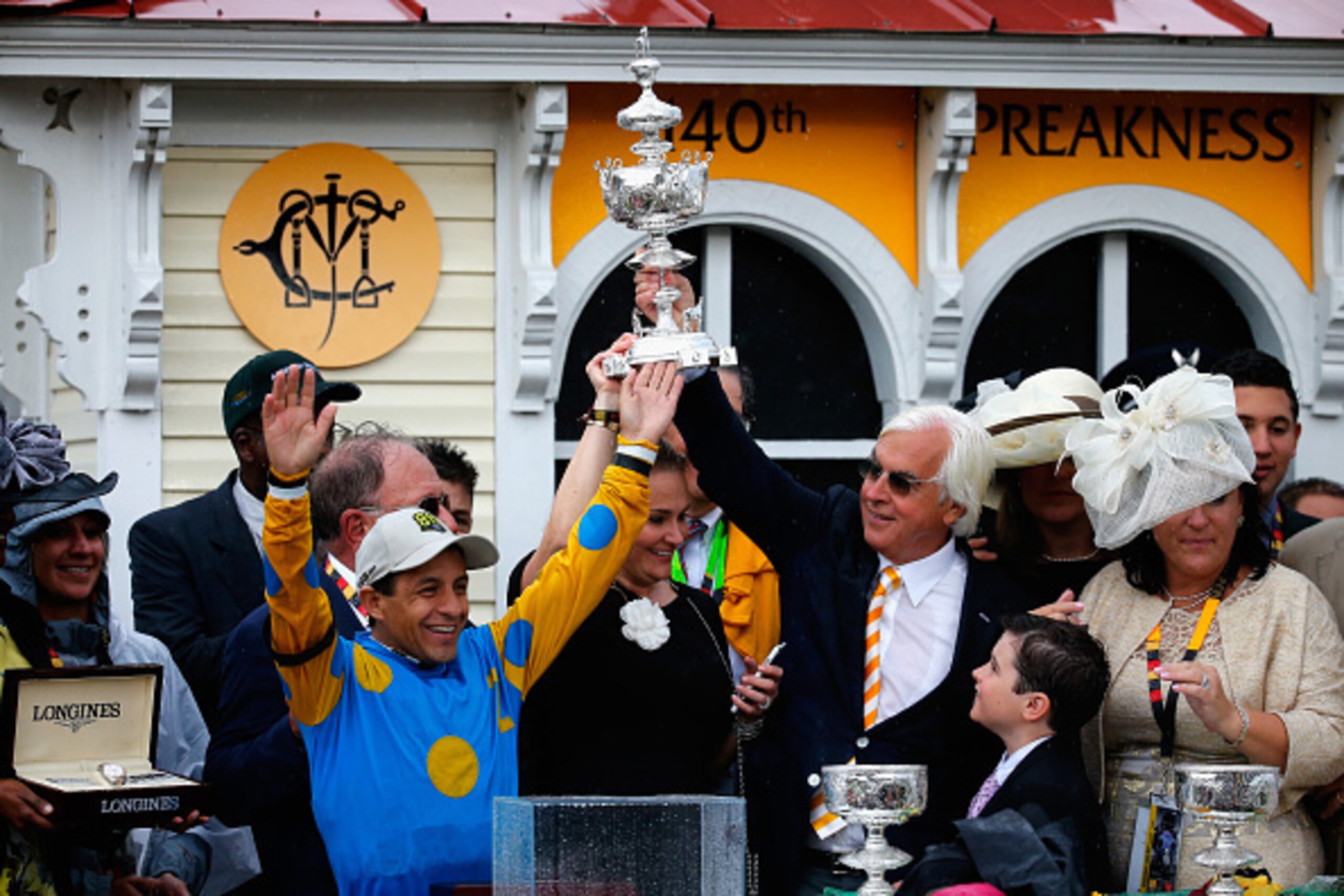 BALTIMORE, MD - MAY 16: Jockey Victor Espinoza (L) and trainer Bob Baffert celebrate in the winners circle after their horse American Pharoah won the 140th running of the Preakness Stakes at Pimlico Race Course on May 16, 2015 in Baltimore, Maryland. (Ph BALTIMORE, MD - MAY 16: Jockey Victor Espinoza (L) and trainer Bob Baffert celebrate in the winners circle after their horse American Pharoah won the 140th running of the Preakness Stakes at Pimlico Race Course on May 16, 2015 in Baltimore, Maryland. (Ph