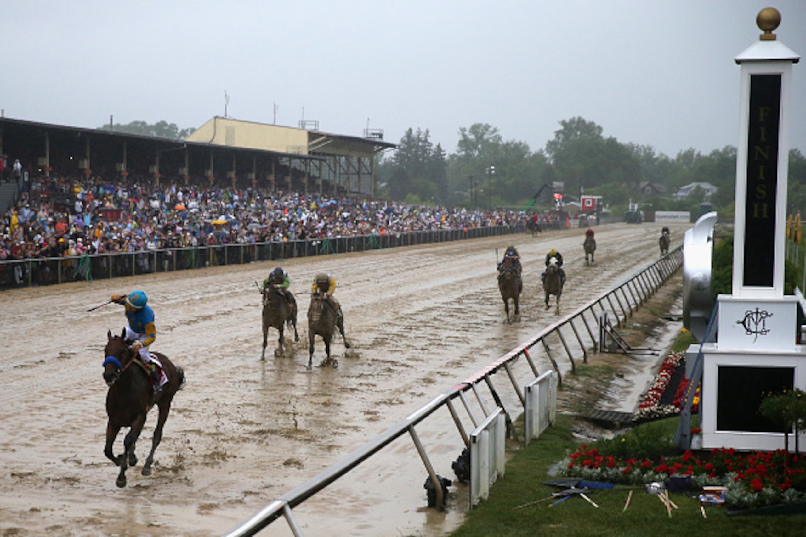 BALTIMORE, MD - MAY 16: American Pharoah #1 ridden by Victor Espinoza crosses the finish line to win the 140th running of the Preakness Stakes at Pimlico Race Course on May 16, 2015 in Baltimore, Maryland. (Photo by Rob Carr/Getty Images) BALTIMORE, MD - MAY 16: American Pharoah #1 ridden by Victor Espinoza crosses the finish line to win the 140th running of the Preakness Stakes at Pimlico Race Course on May 16, 2015 in Baltimore, Maryland. (Photo by Rob Carr/Getty Images)