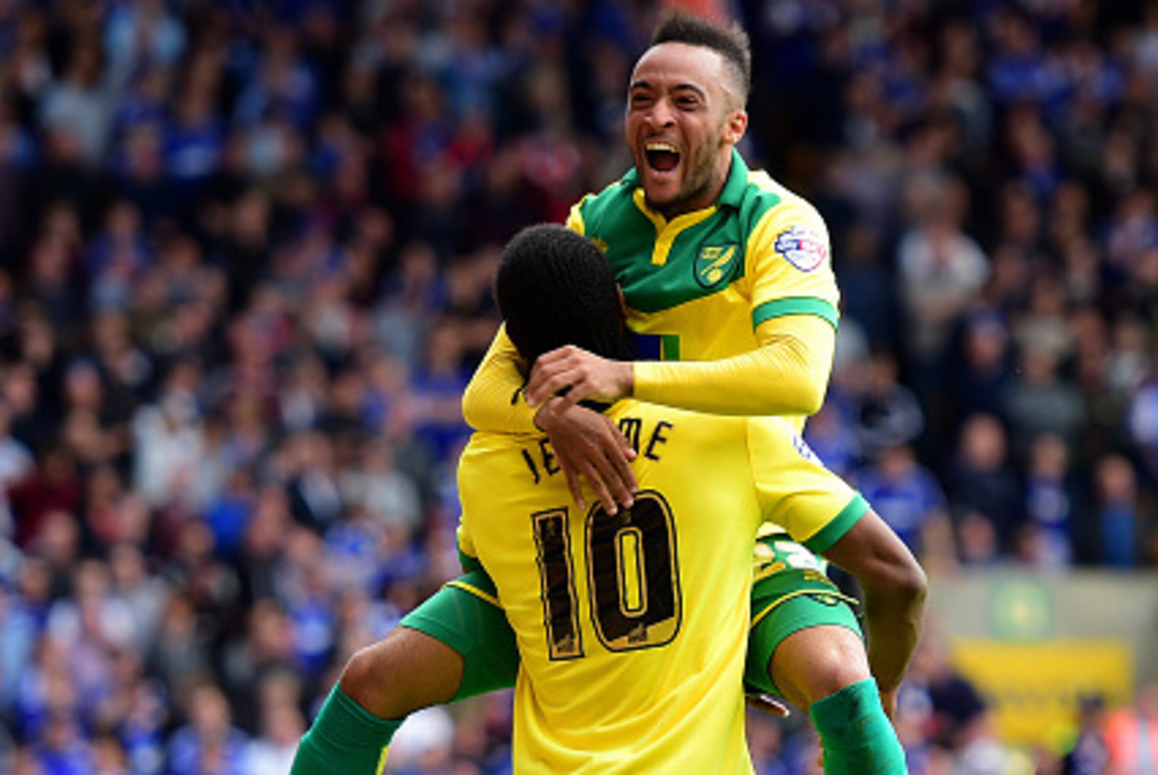 NORWICH, ENGLAND - MAY 16:  Cameron Jerome of Norwich City (10) celebrates with team mate Nathan Redmond as he scores their third goal during the Sky Bet Championship Playoff semi final second leg match between Norwich City and Ipswich Town  at Carrow Roa