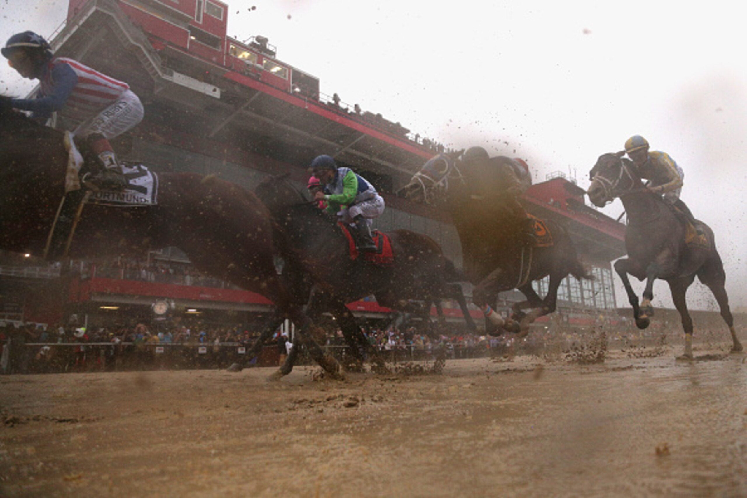BALTIMORE, MD - MAY 16: The field makes a first past down the front strech during the 140th running of the Preakness Stakes at Pimlico Race Course on May 16, 2015 in Baltimore, Maryland.  (Photo by Patrick Smith/Getty Images)