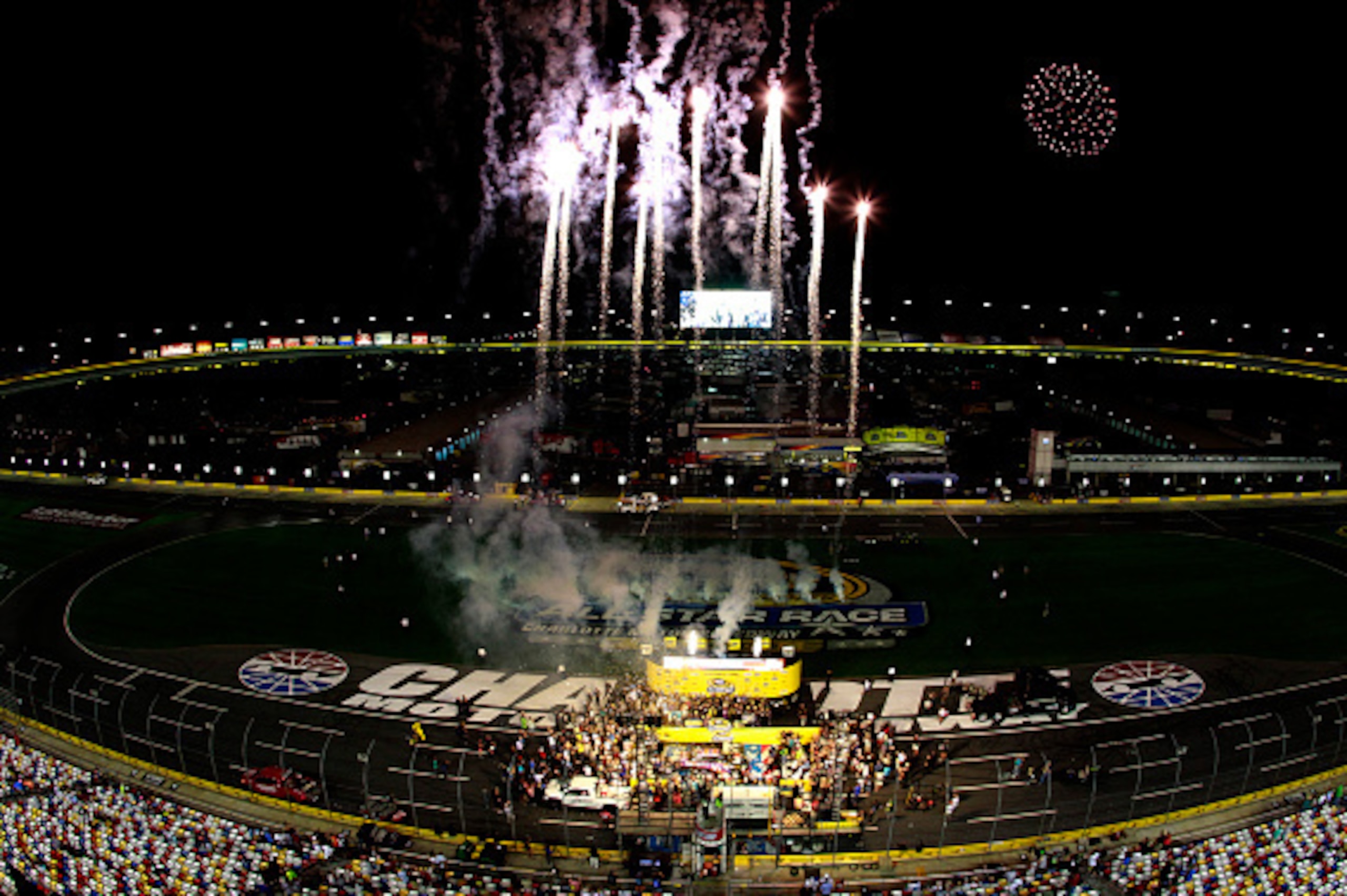 CHARLOTTE, NC - MAY 16: Denny Hamlin, driver of the #11 FedEx Express Toyota, celebrates in victory lane after winning the NASCAR Sprint Cup Series Sprint All-Star Race at Charlotte Motor Speedway on May 16, 2015 in Charlotte, North Carolina.  (Photo by B