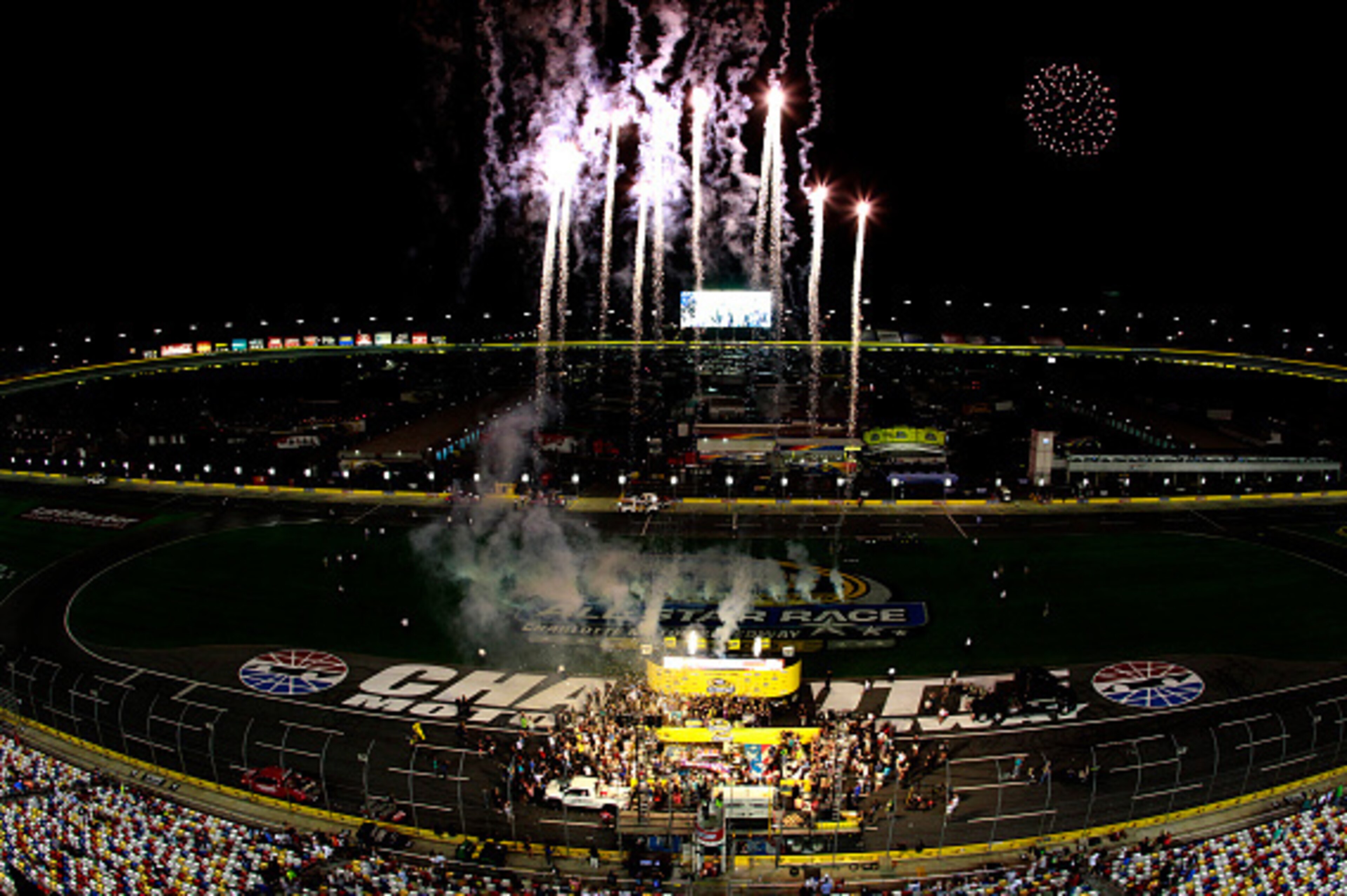 CHARLOTTE, NC - MAY 16: Denny Hamlin, driver of the #11 FedEx Express Toyota, celebrates in victory lane after winning the NASCAR Sprint Cup Series Sprint All-Star Race at Charlotte Motor Speedway on May 16, 2015 in Charlotte, North Carolina.  (Photo by B