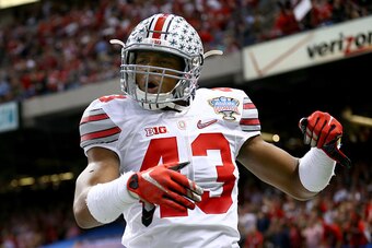 NEW ORLEANS, LA - JANUARY 01:  Darron Lee #43 celebrates teammate Steve Miller #88 of the Ohio State Buckeyes after scoring a 41 yard interception return from Blake Sims #6 of the Alabama Crimson Tide in the third quarter during the All State Sugar Bowl a