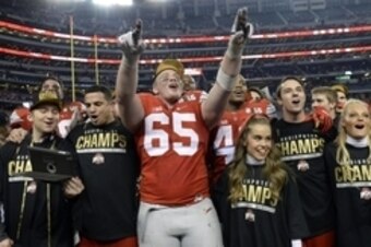 Jan 12, 2015; Arlington, TX, USA; Ohio State Buckeyes offensive lineman Pat Elflein (65) celebrates after beating the Oregon Ducks in the 2015 CFP National Championship Game at AT&T Stadium. Mandatory Credit: Tommy Gilligan-USA TODAY Sports